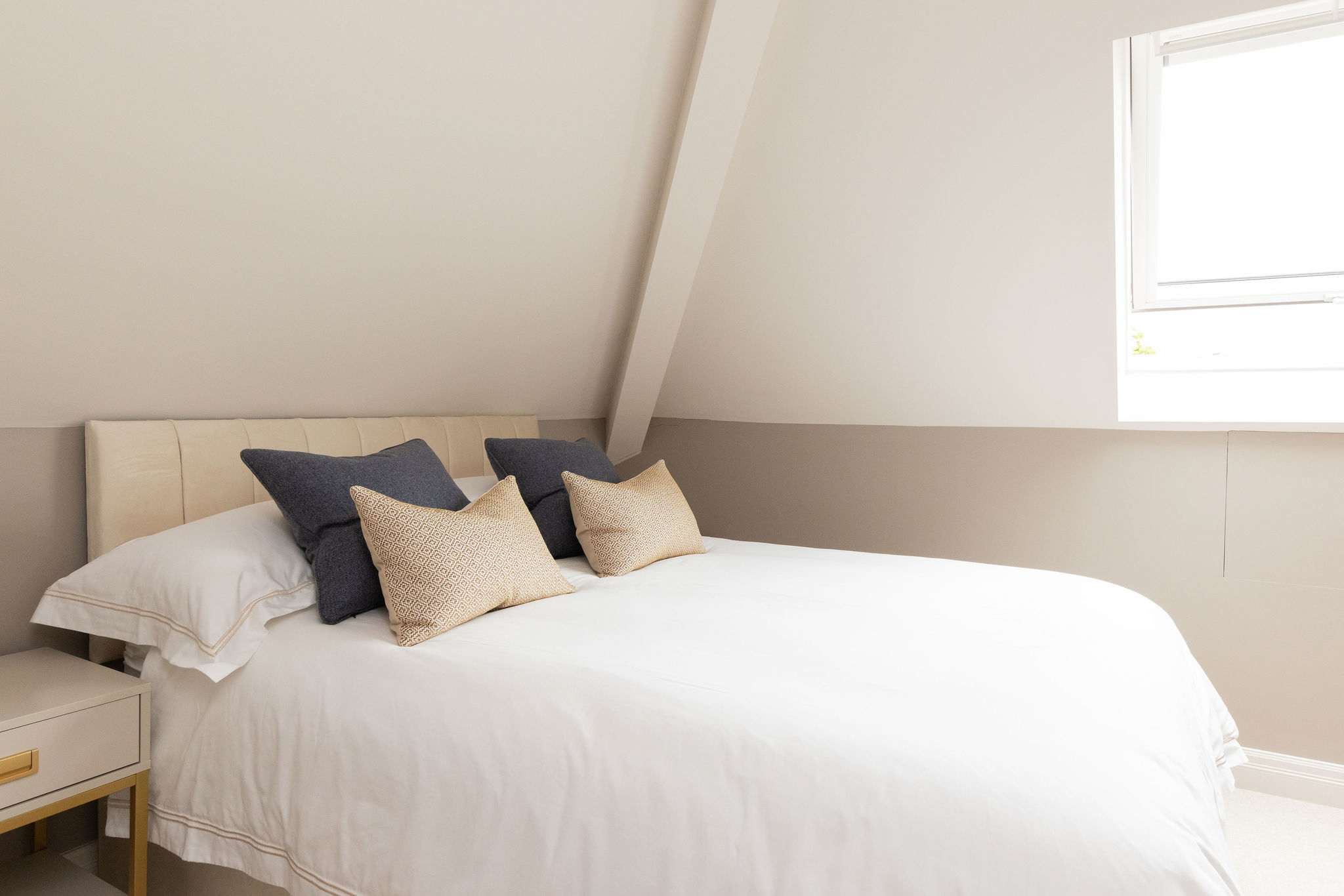 Cosy top-floor triple bedroom with soft natural light