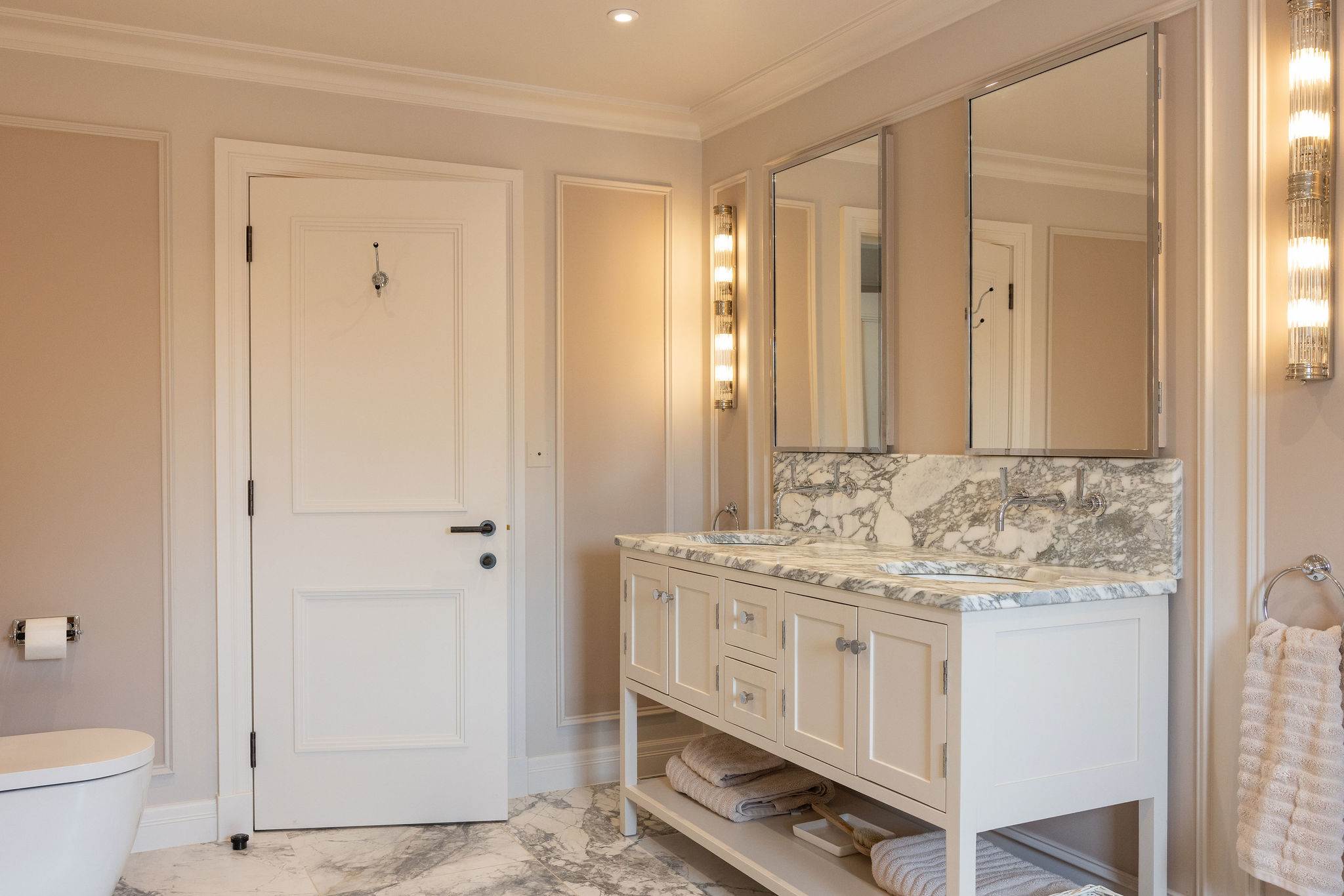 Elegant master bathroom with double marble vanity