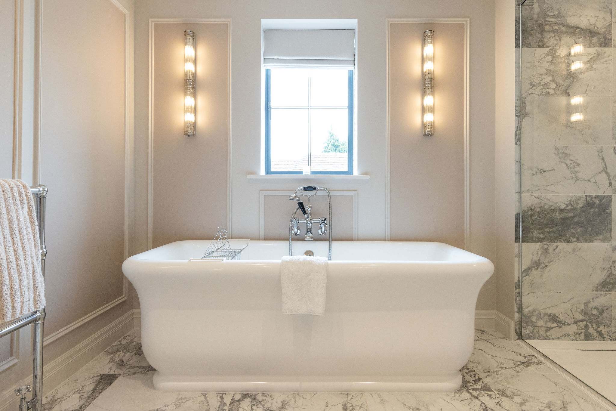 A tranquil retreat with deep tub and soft lighting for ultimate relaxation