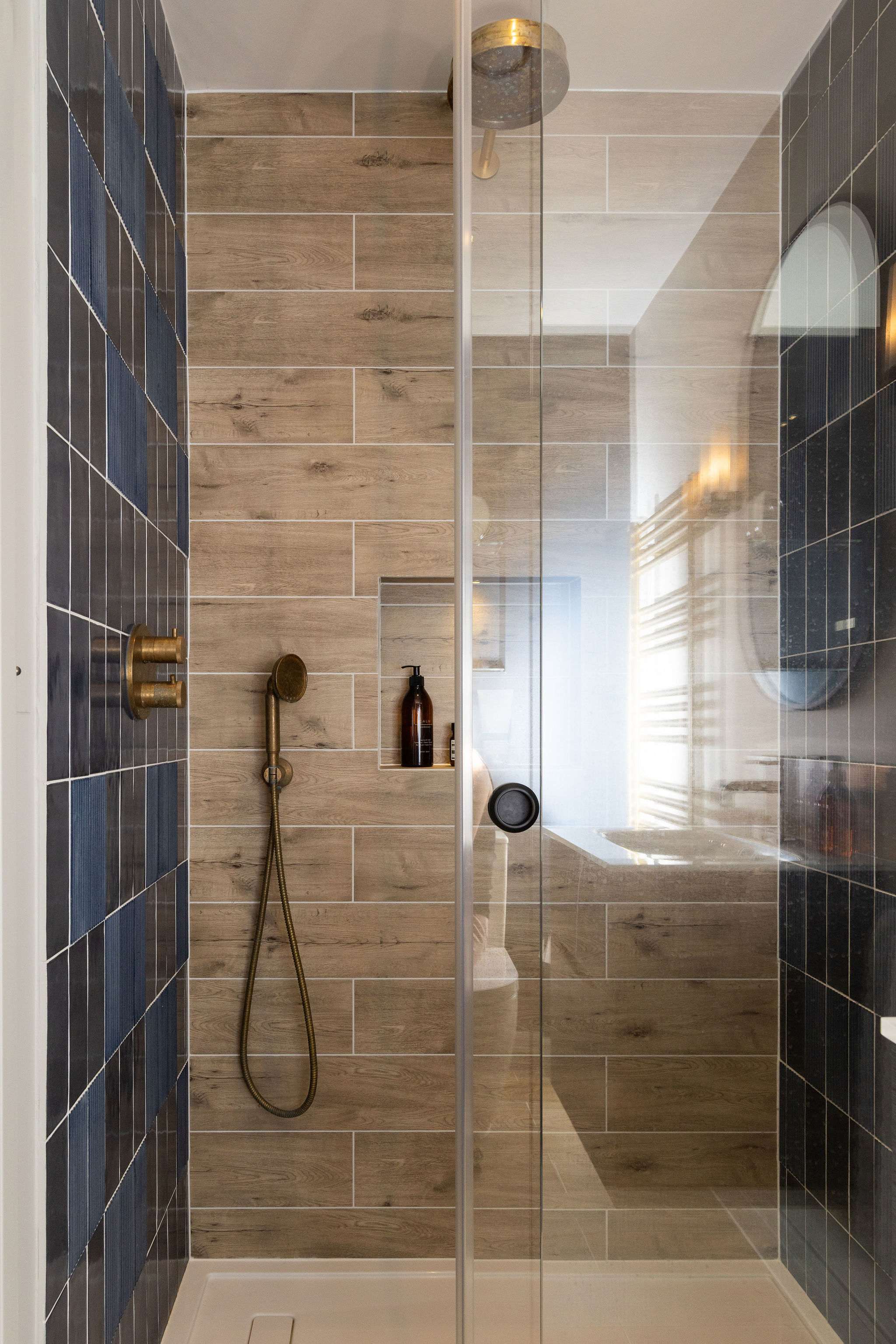 Stylish walk-in shower with wood-effect tiles