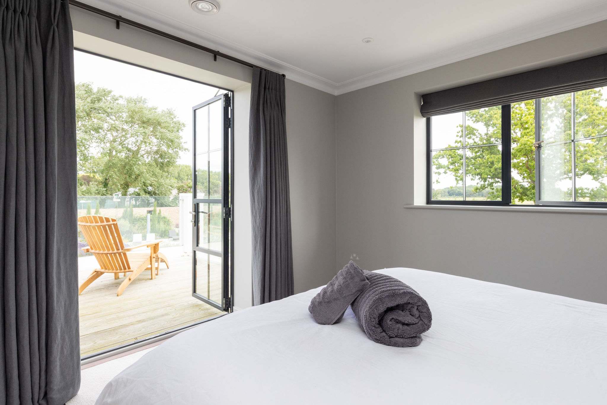 Bedroom 4 with open doors to terrace