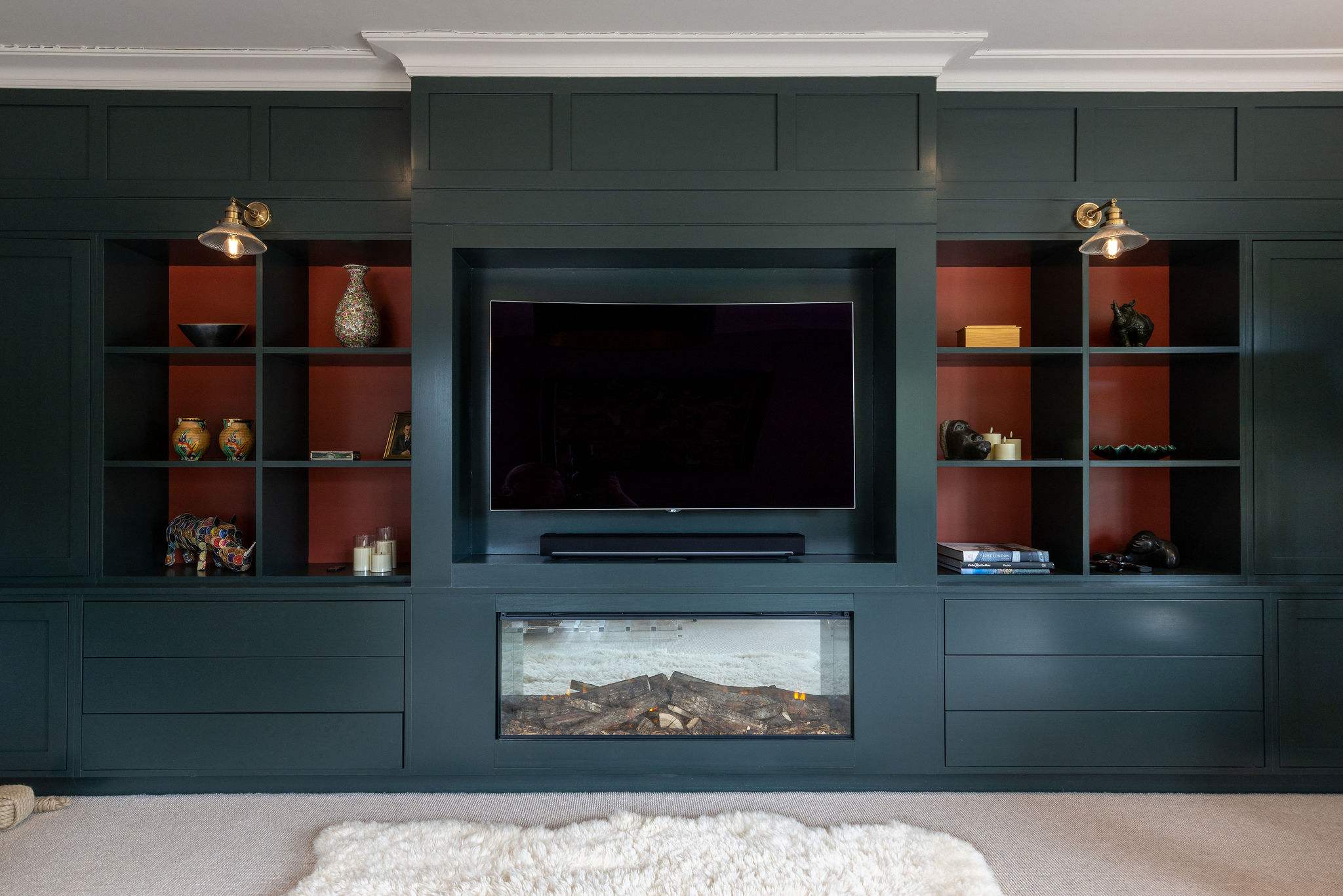 Cosy up in the lounge with a built-in media wall, electric fire, and curated art and décor