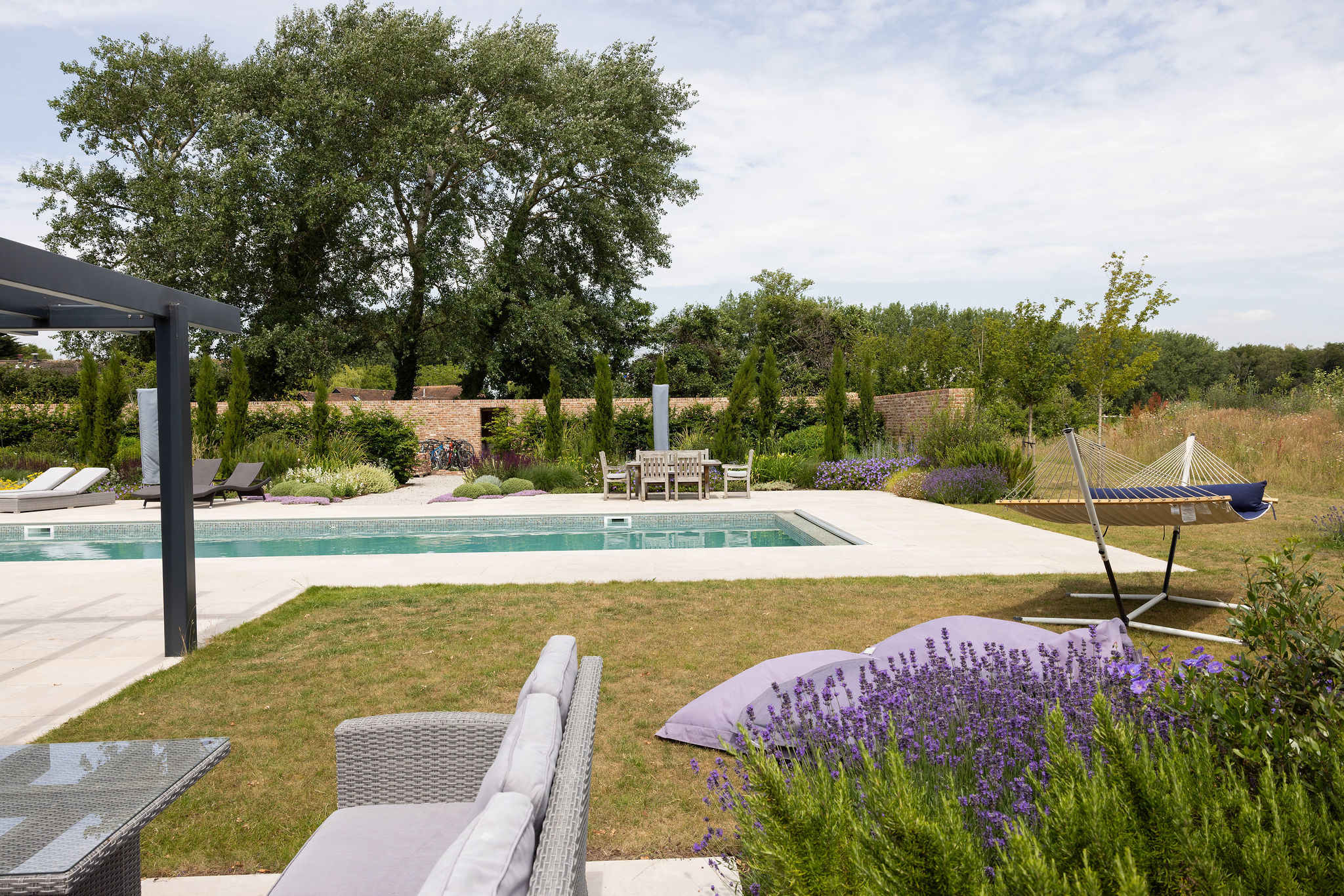 Unwind in the hammock or recline on sun loungers overlooking the peaceful private gardens.