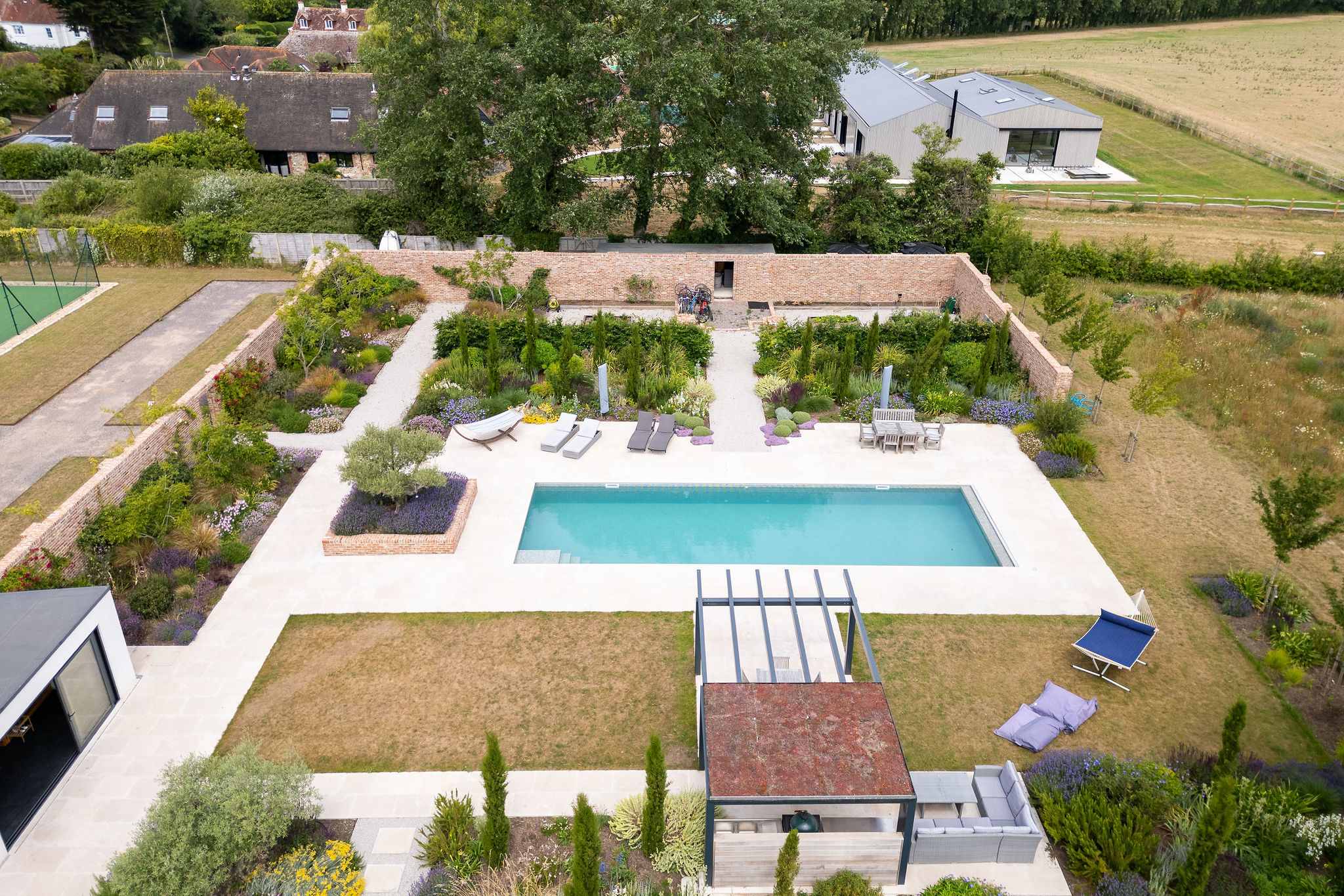 Landscaped gardens surrounding the heated outdoor pool