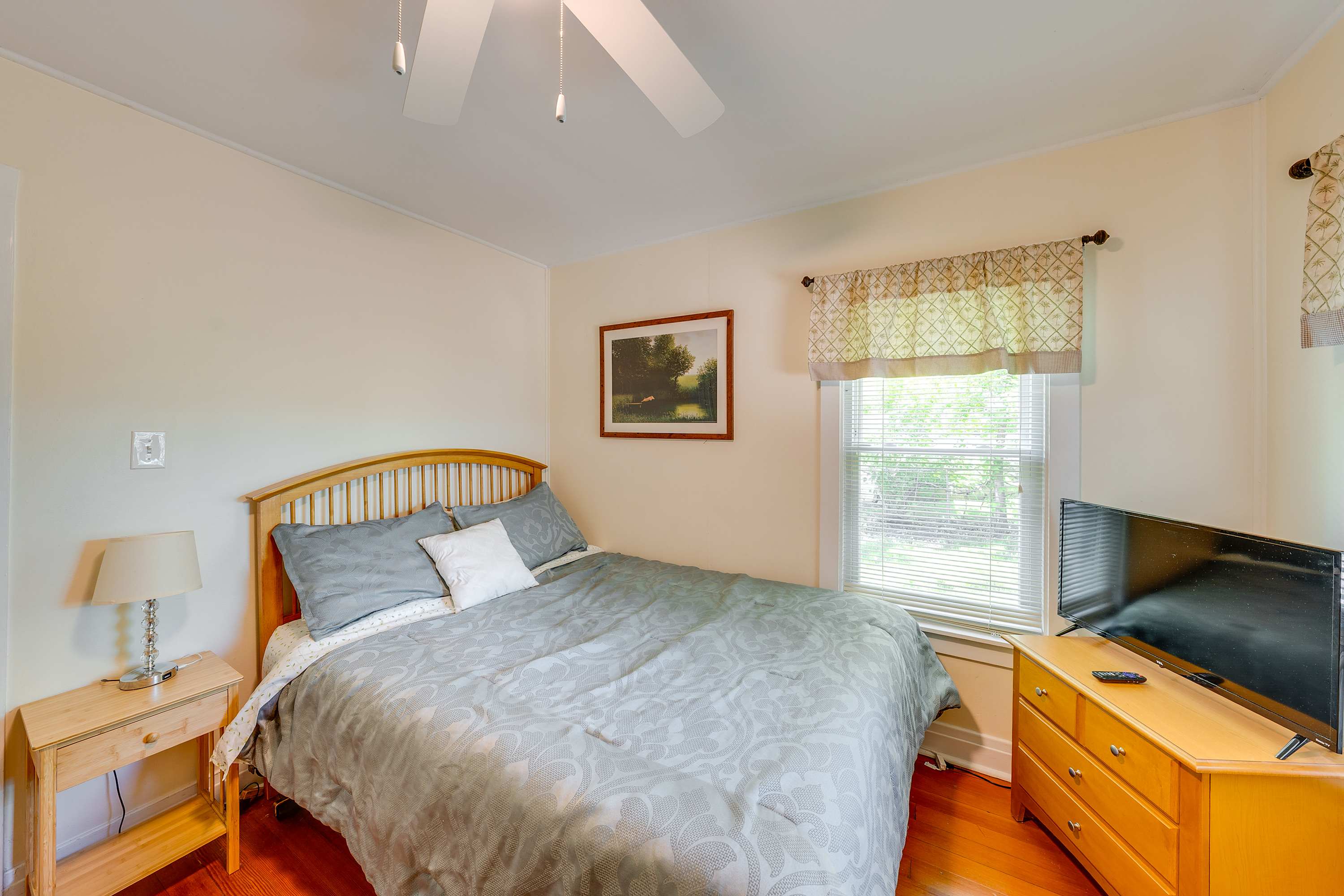 Recharge in this tranquil queen bedroom, offering its own smart TV​