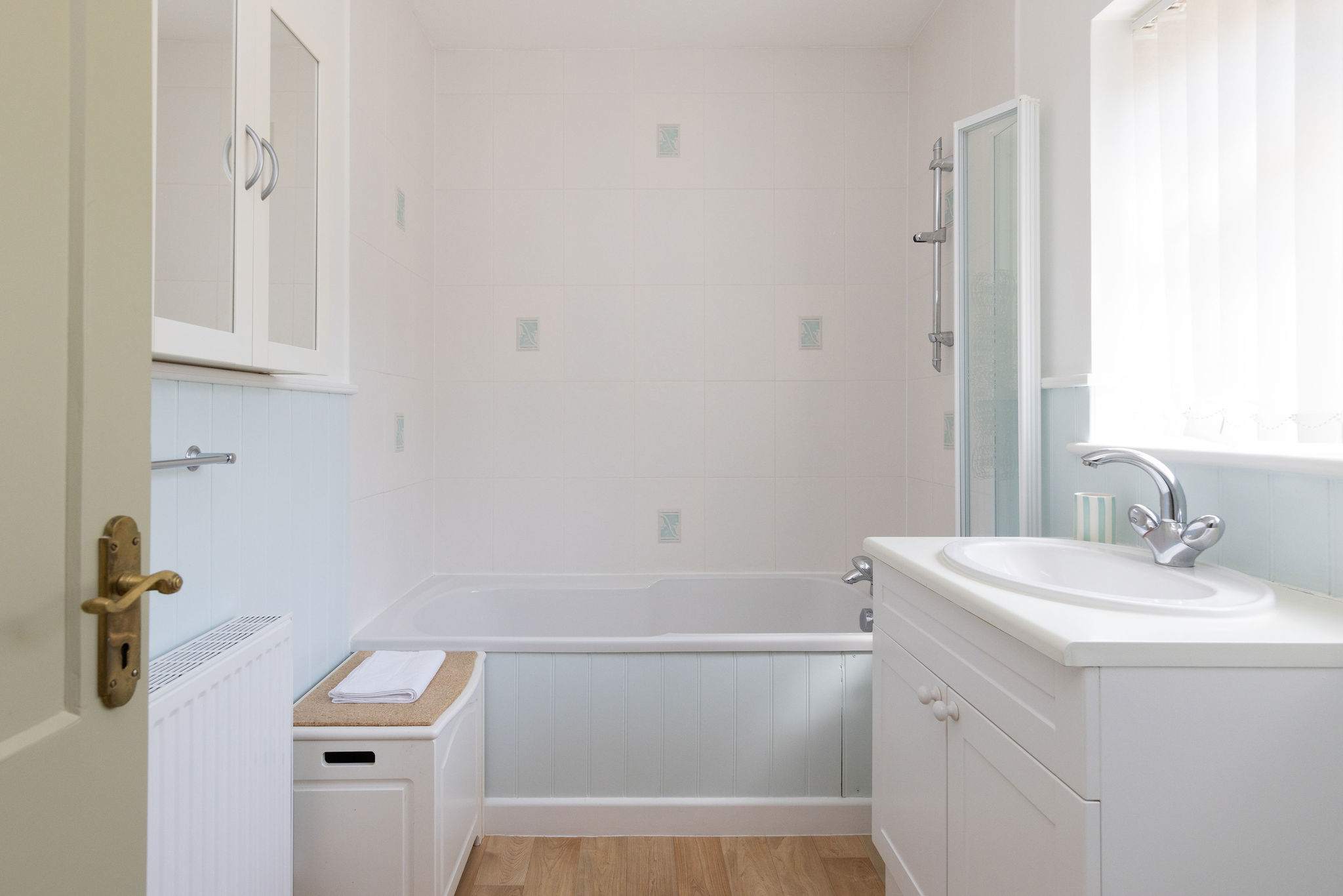 The ensuite has a bath, overbath shower, WC and sink.