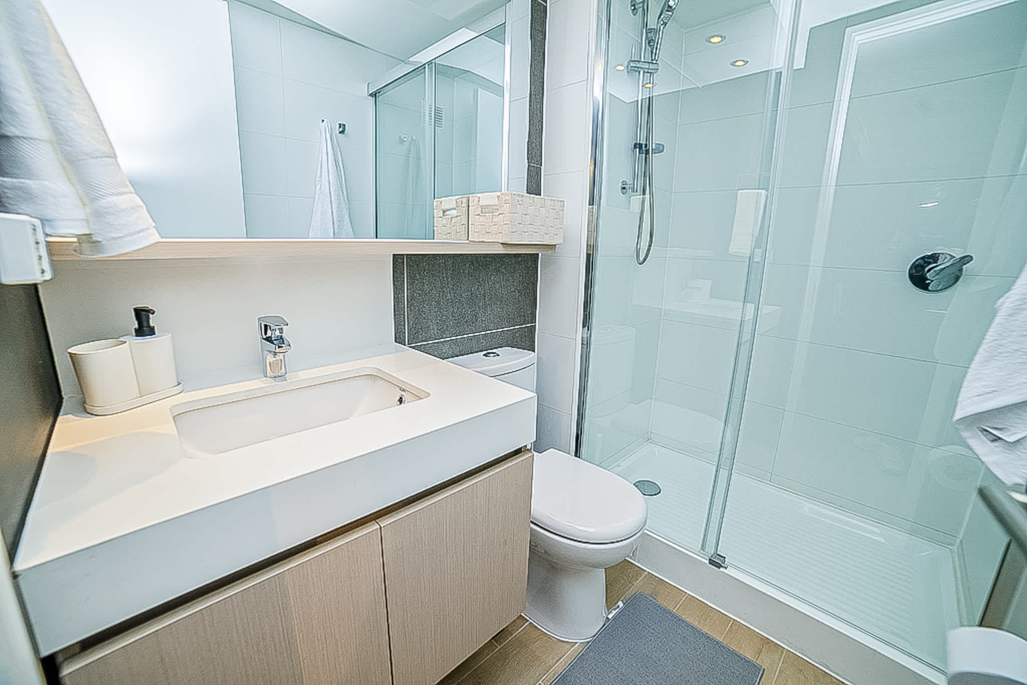 Experience modern comfort in this sleek bathroom with a spacious shower and contemporary design.