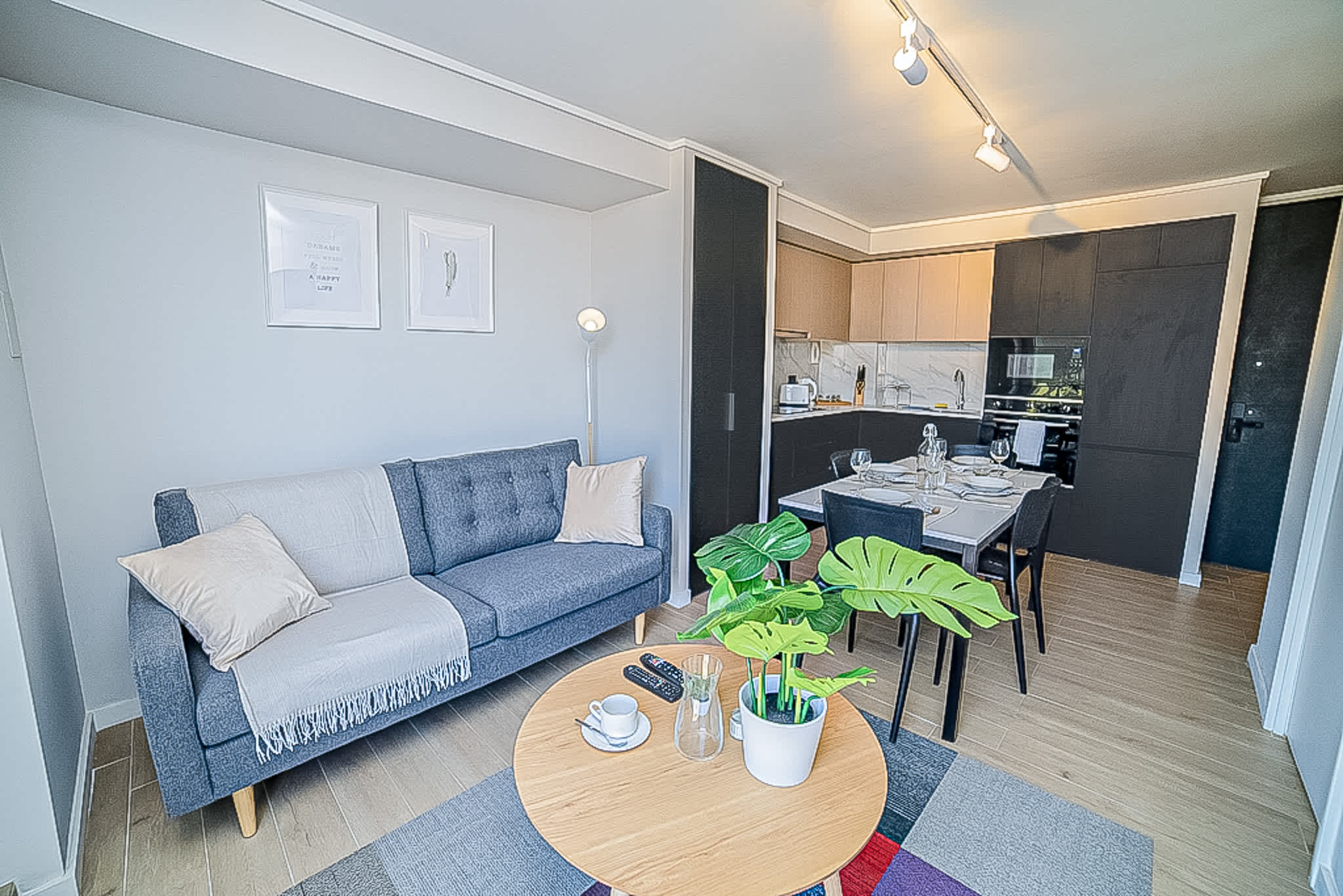 Cozy and stylish living space with a modern kitchen and dining area, perfect for a relaxing stay in the heart of Chile.