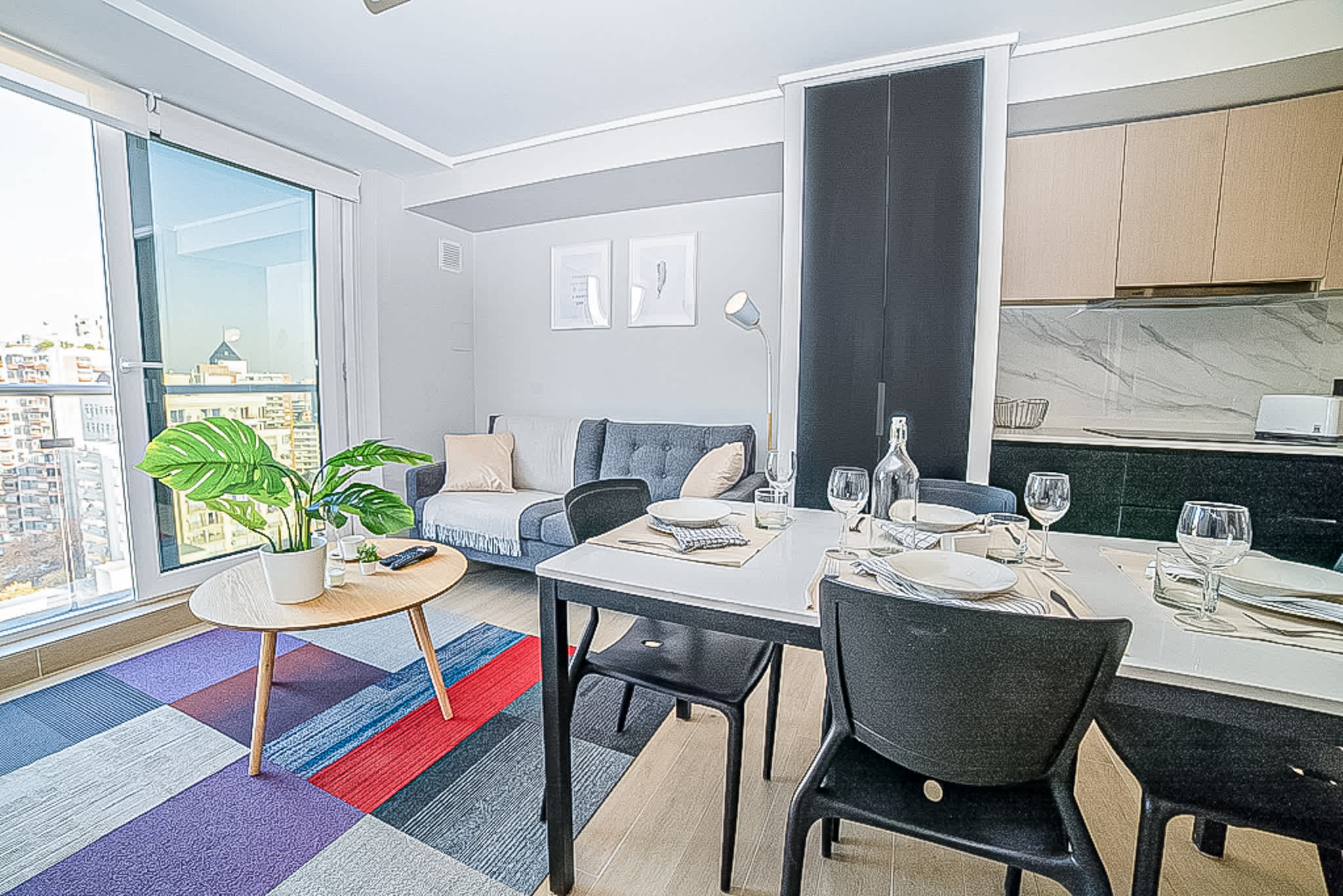 Experience urban living in this stylish studio with stunning city views, a cozy living area, and a modern kitchen.