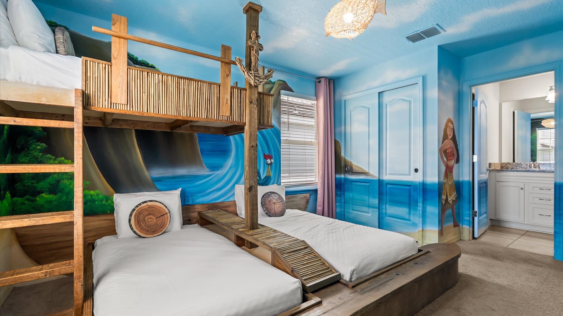 Moana themed bedroom with en-suite bathroom | Each bedroom brings a beloved story to life with custom murals, themed décor, and comfy bedding. A magical space for kids (and kids-at-heart) to dream big.