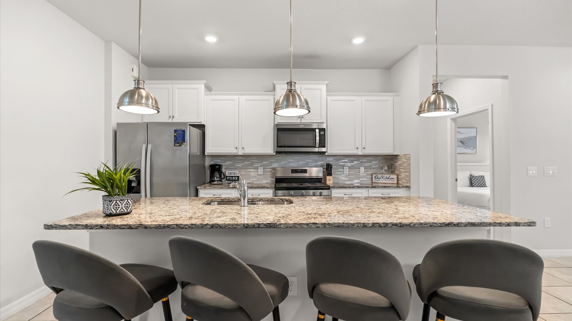 Casual dining is a breeze at the kitchen island with barstool seating—great for morning coffee or quick bites before heading out.