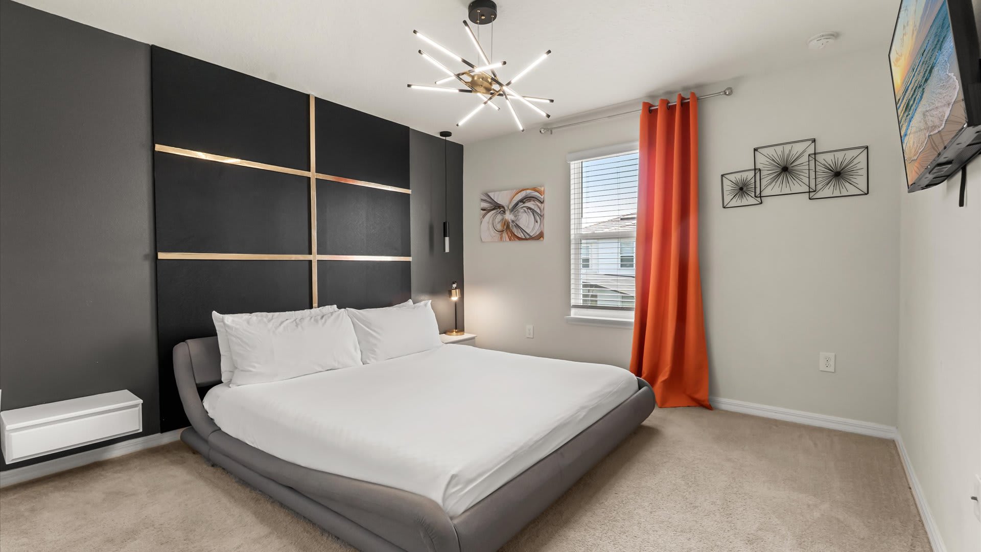 Spacious king bedroom with fresh linens, contemporary décor, and easy access to a shared bathroom.
