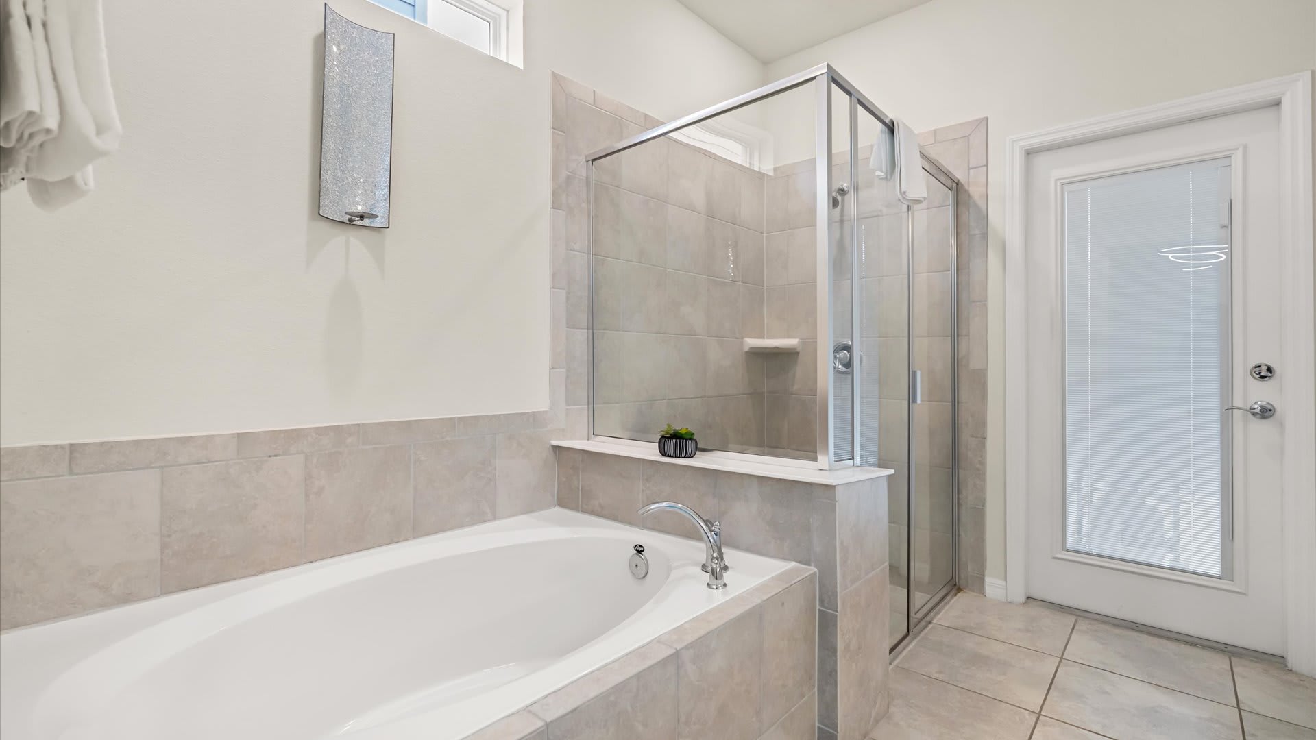 Enjoy the option of a refreshing shower or a soak in the spa-like bathtub