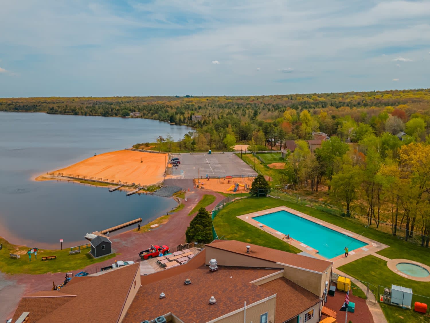 Community Pool and Clubhouse with Scenic Lake Views