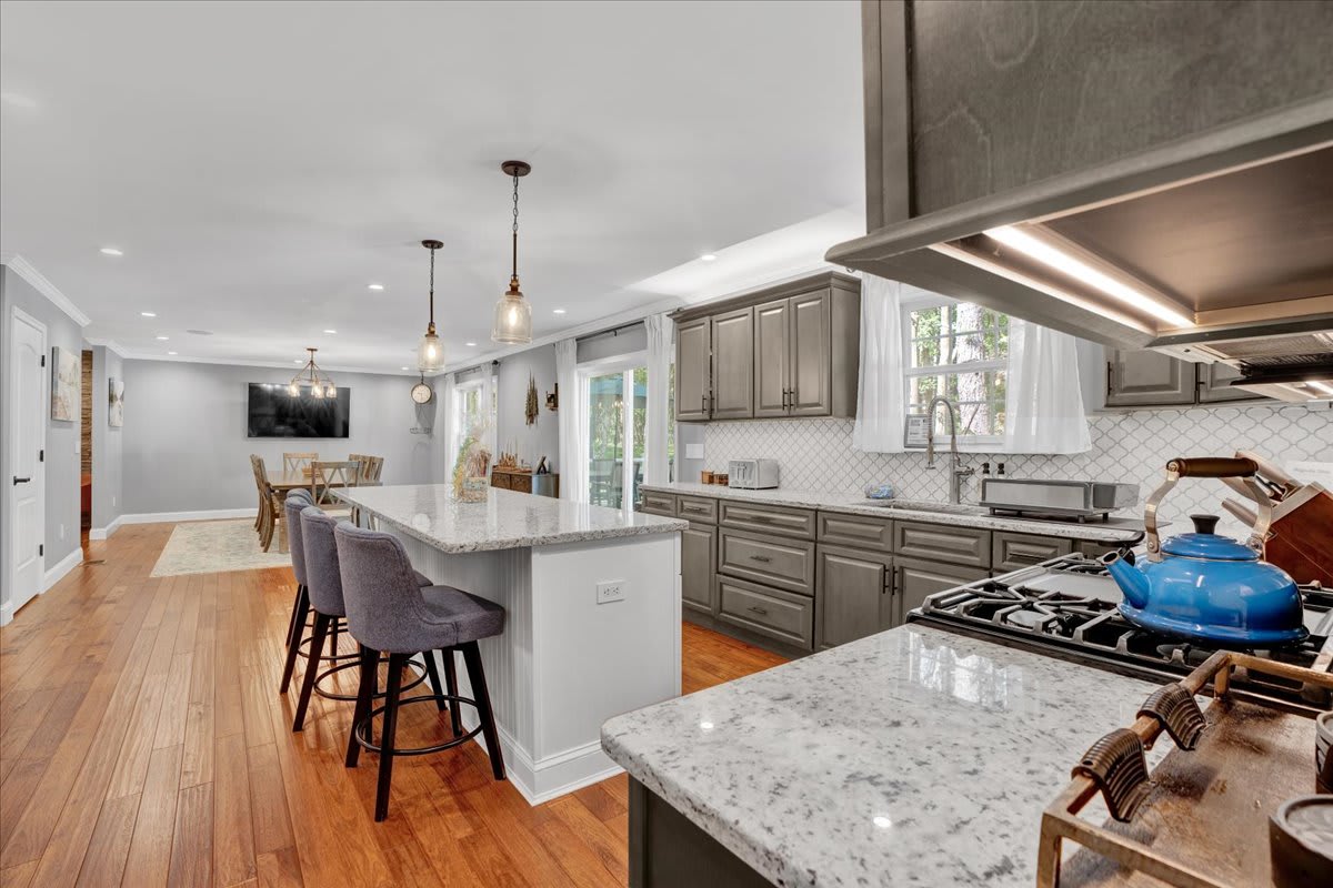 Chef's Kitchen with Granite Countertops and Island Seating