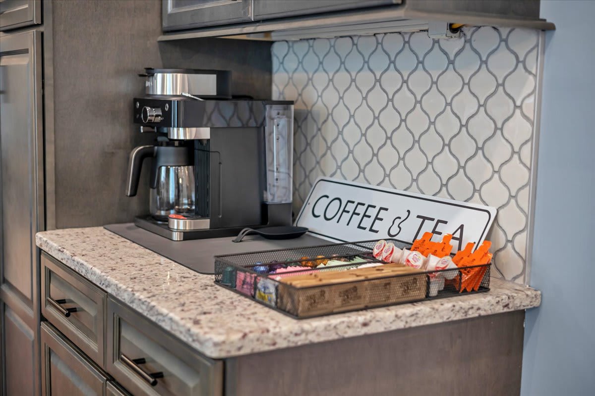 Well-Appointed Kitchen with Granite Island and Pendant Lighting