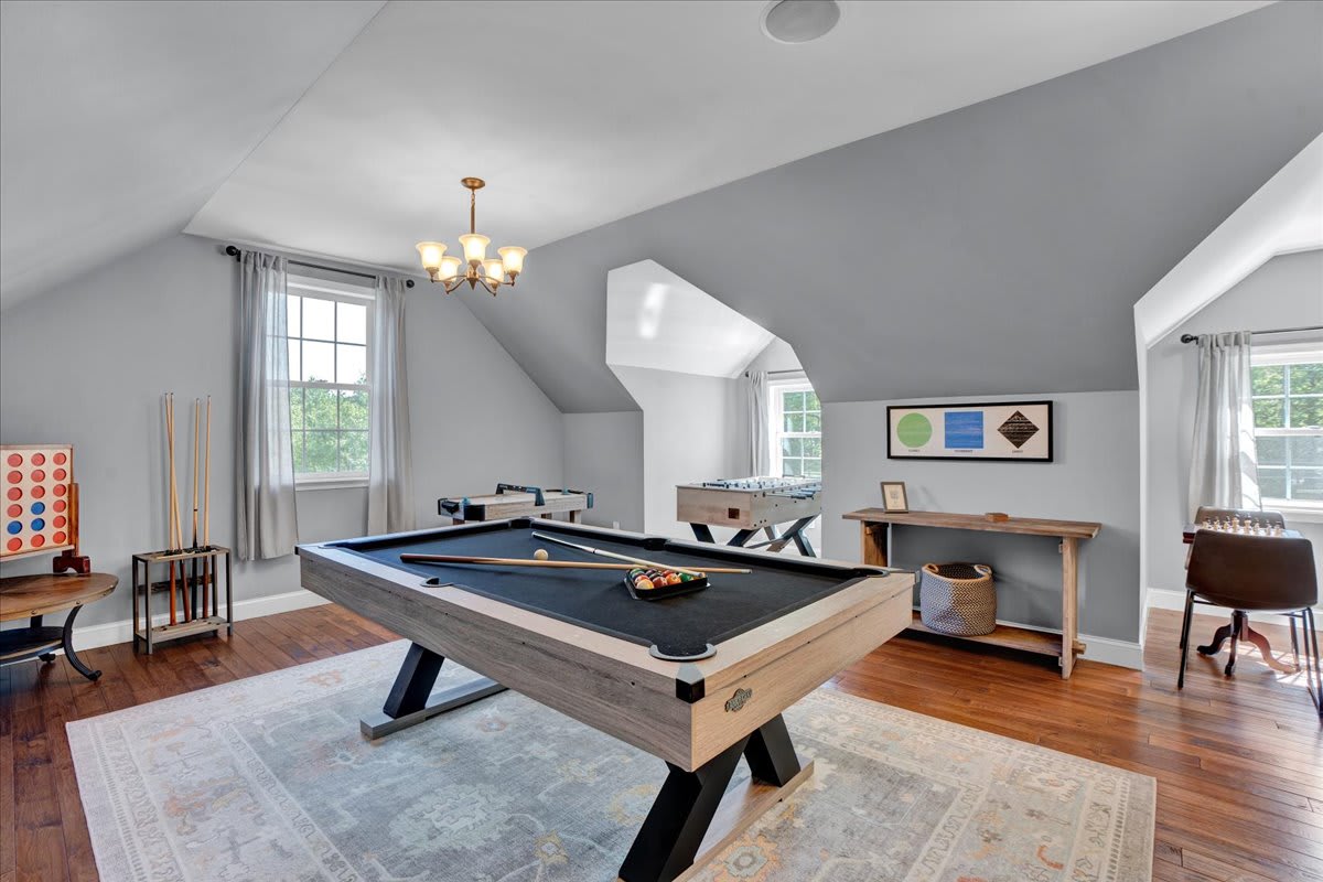 Entertainment Room with Pool Table and Lounge Seating