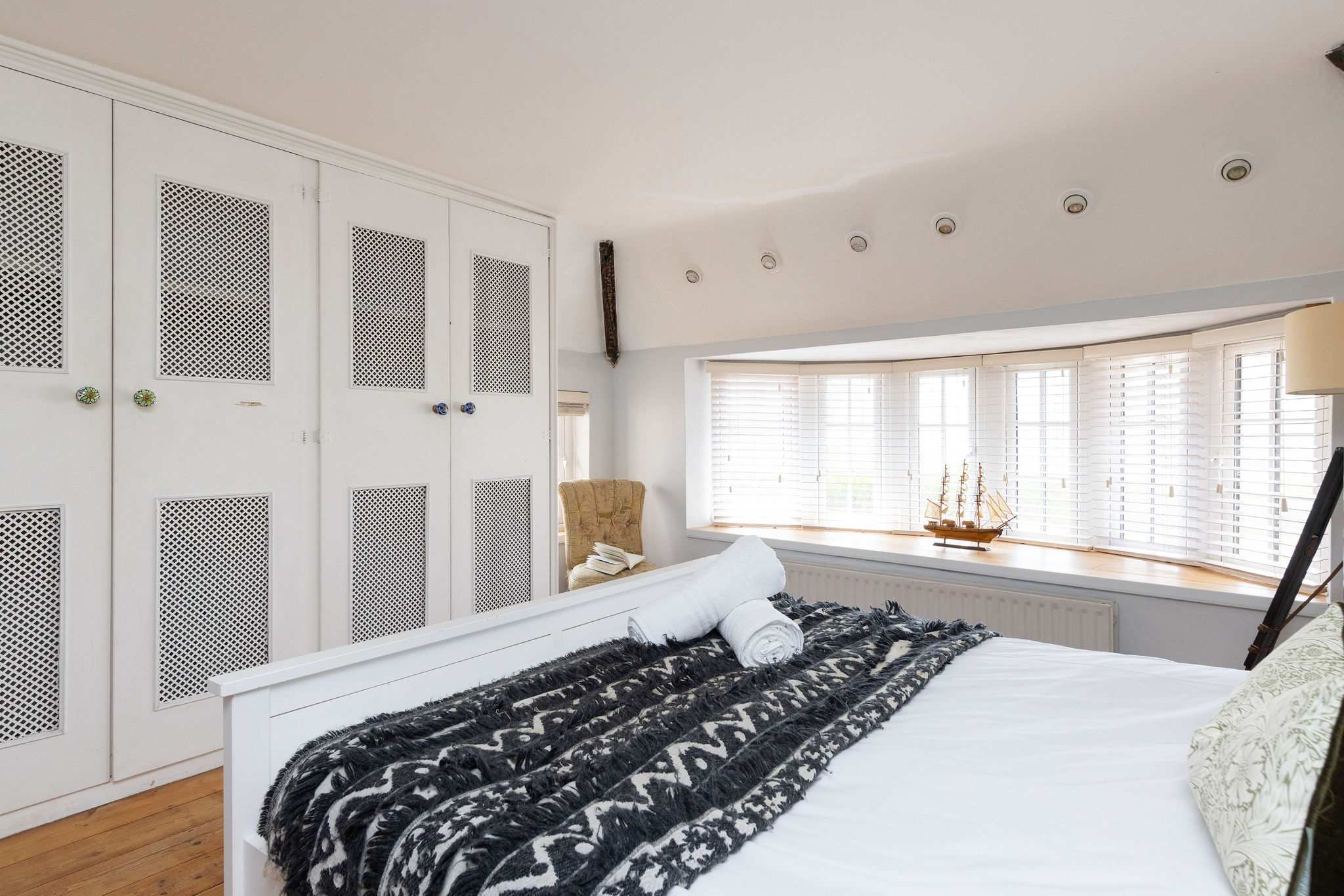 With ample wardrobe space and large bay windows.