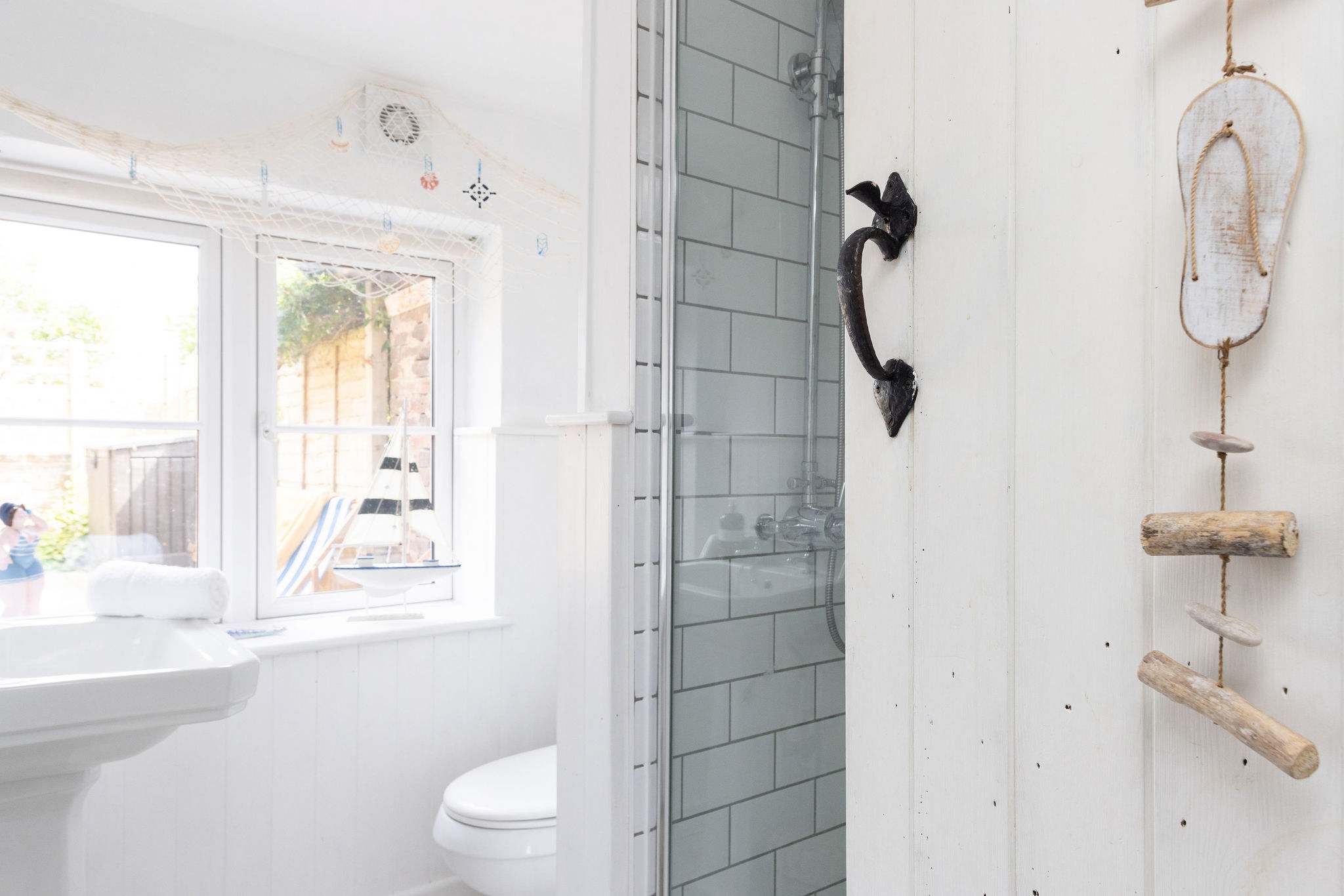 This bathroom features a seaside nautical theme!