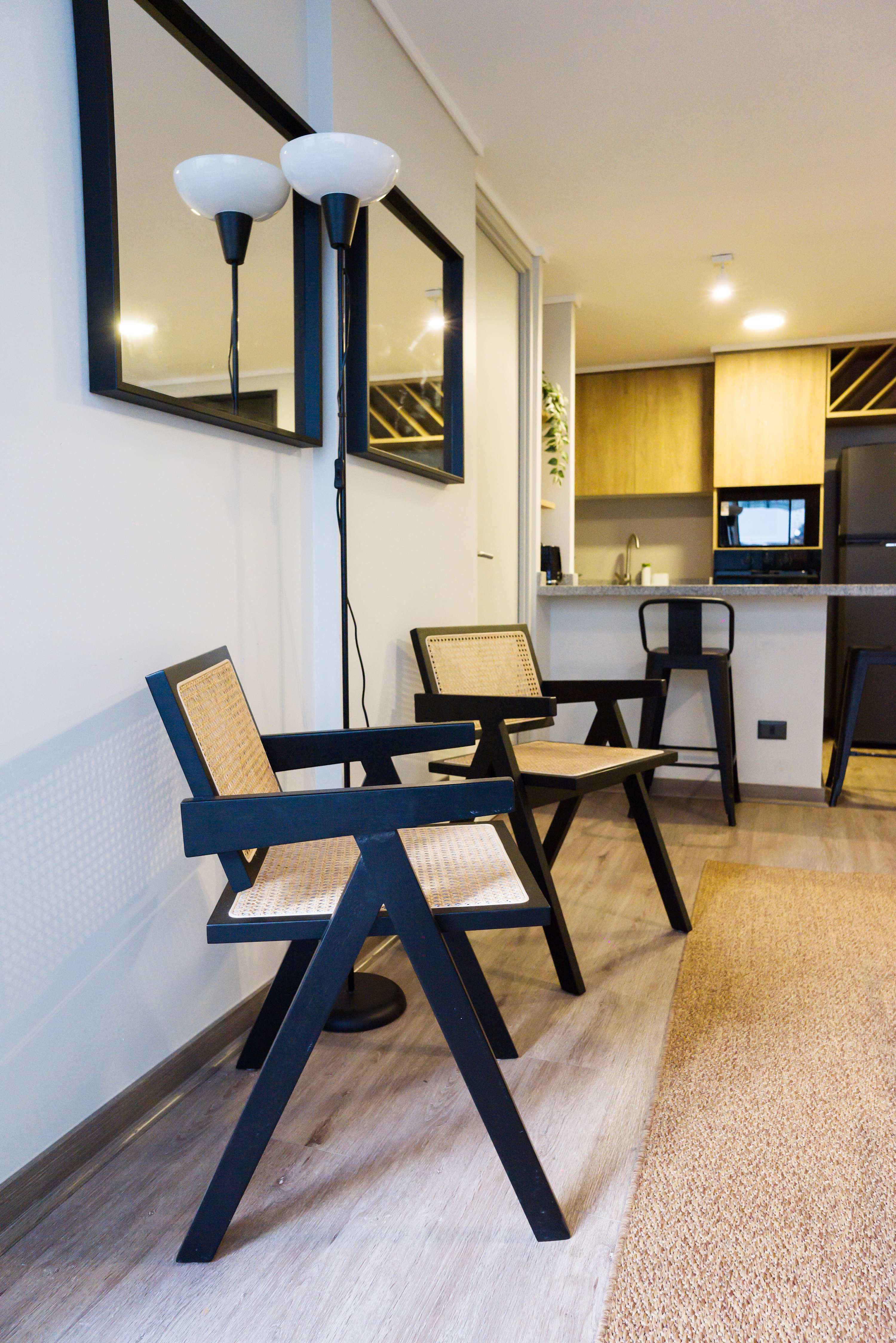 Relax in this stylish studio with a cozy seating area and modern kitchen, perfect for a comfortable stay in the heart of Chile.