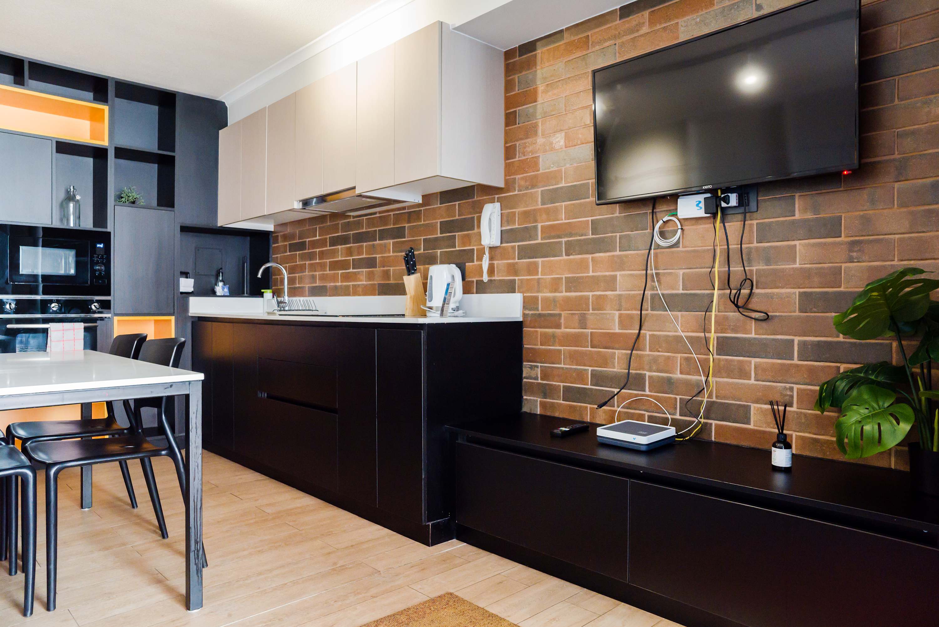 Stylish kitchen with modern amenities and a cozy dining area, perfect for enjoying meals in comfort.