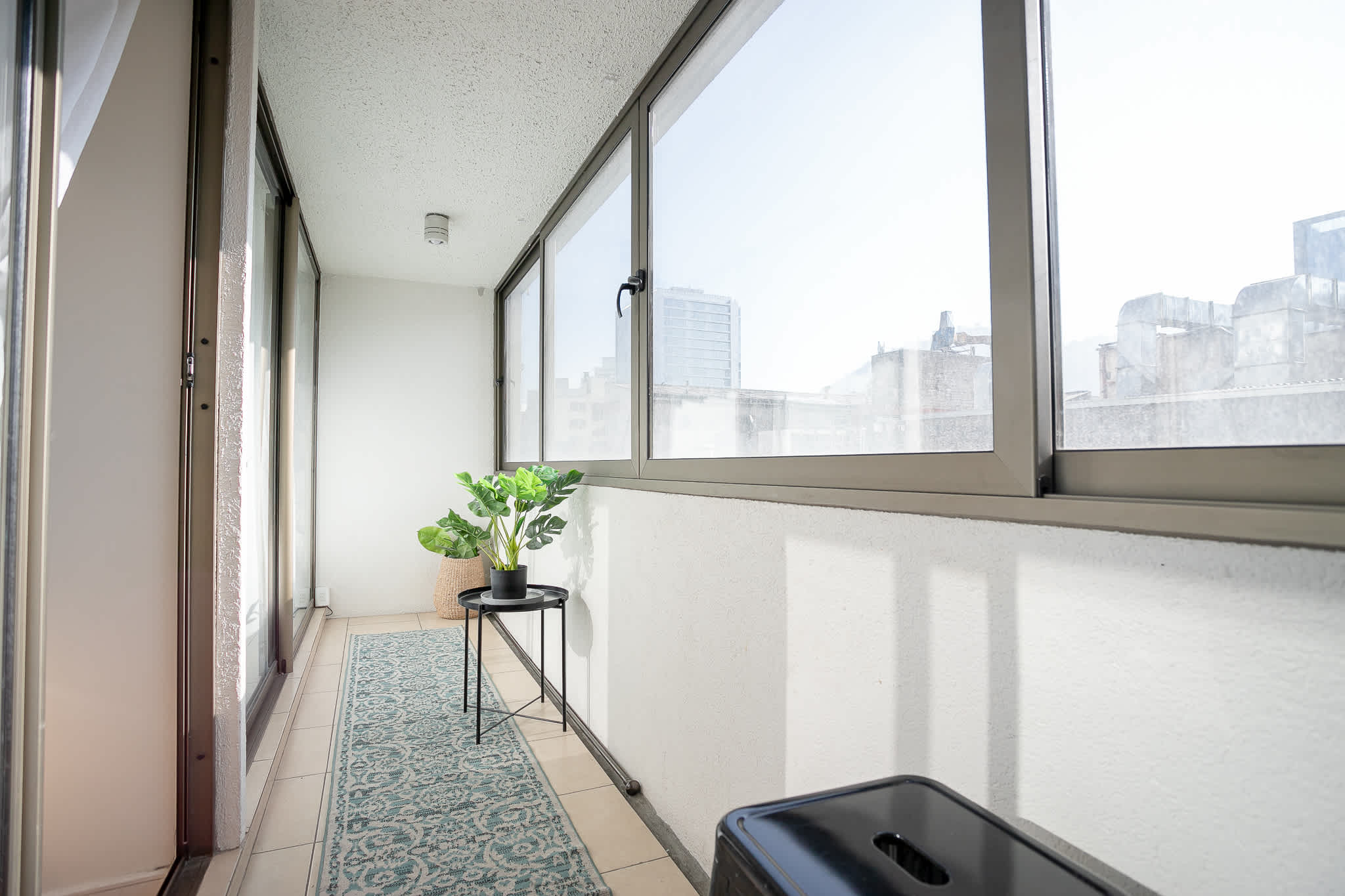 Enjoy city views from this bright and cozy enclosed balcony, perfect for a morning coffee or evening relaxation.