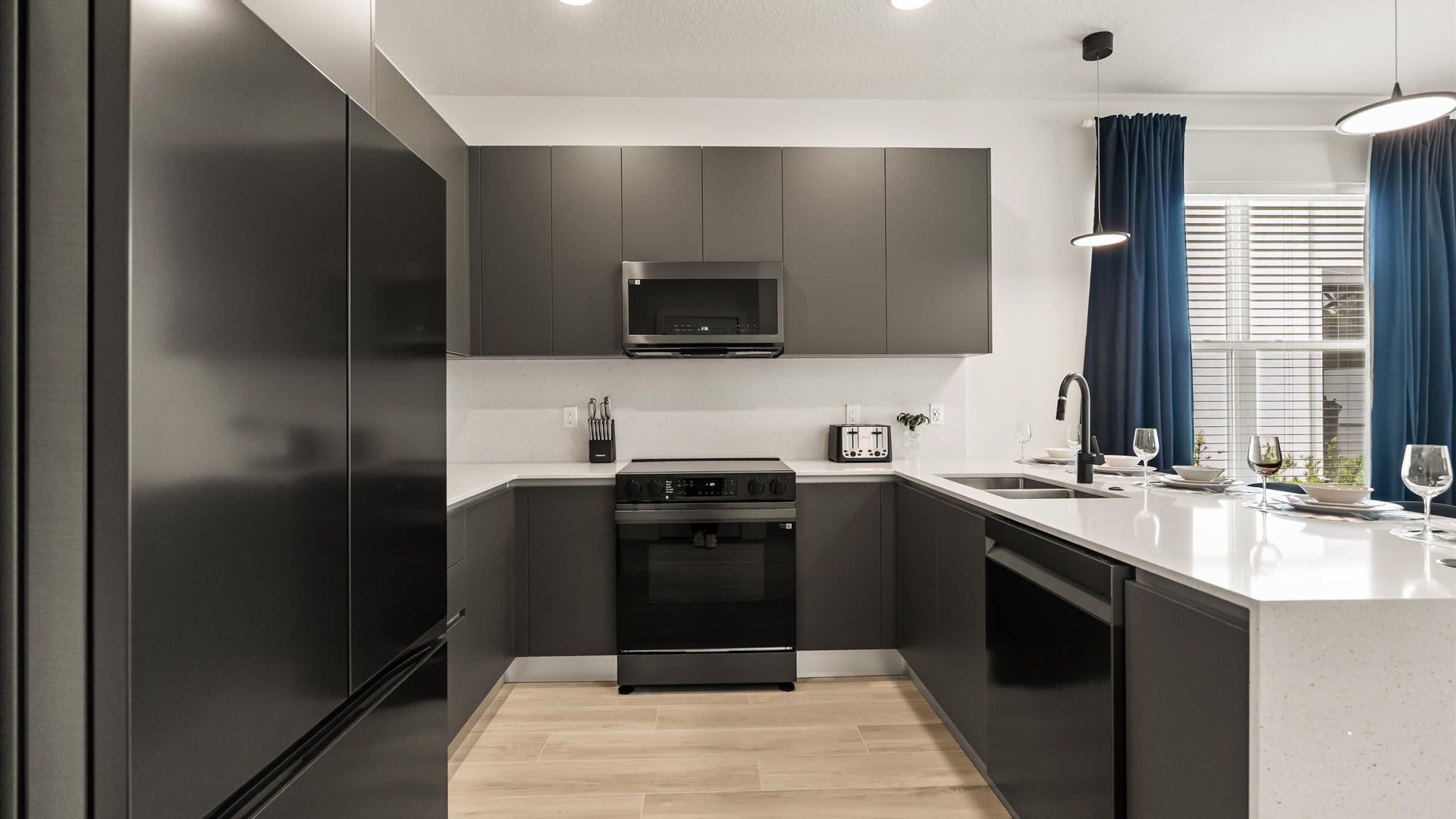 Beautiful fully equipped kitchen with black finishes and modern appliances