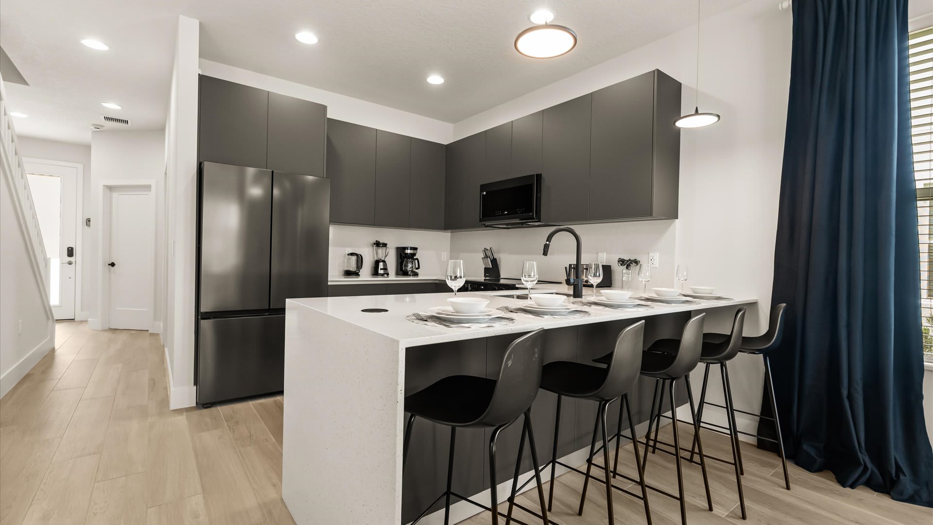 Kitchen area with breakfast bar seating 