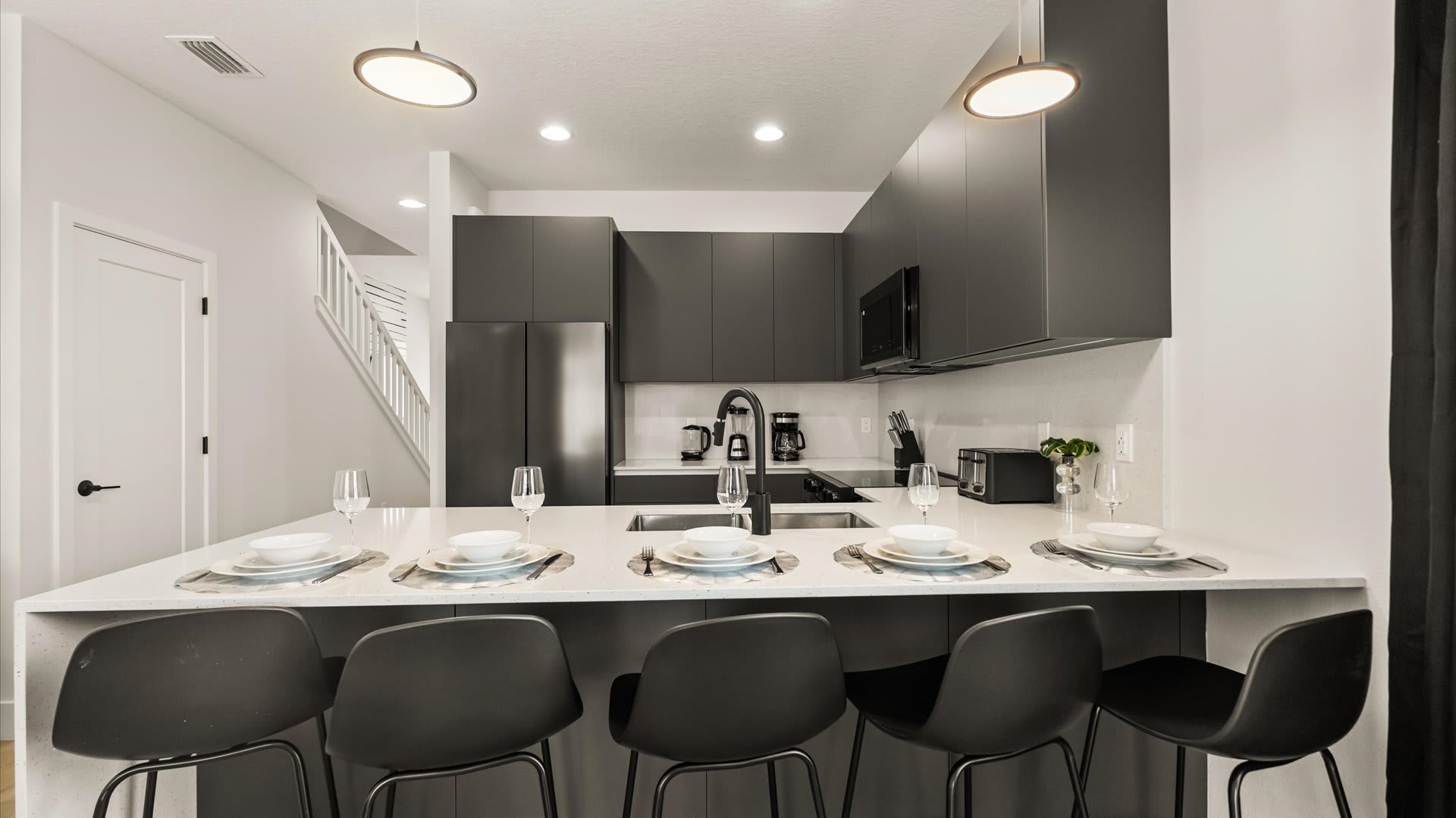 Kitchen area with breakfast bar seating 