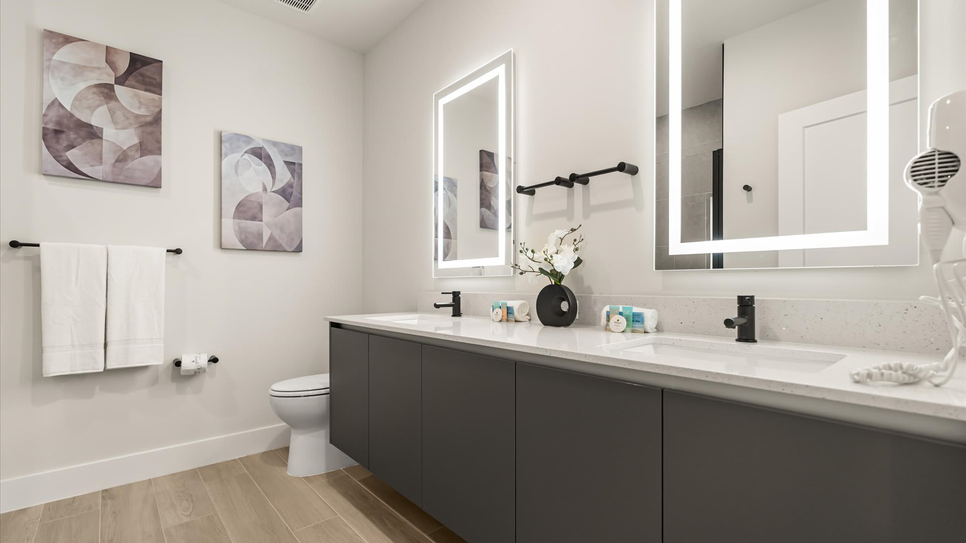 Spacious Bathroom with Double Vanity and LED Mirrors 