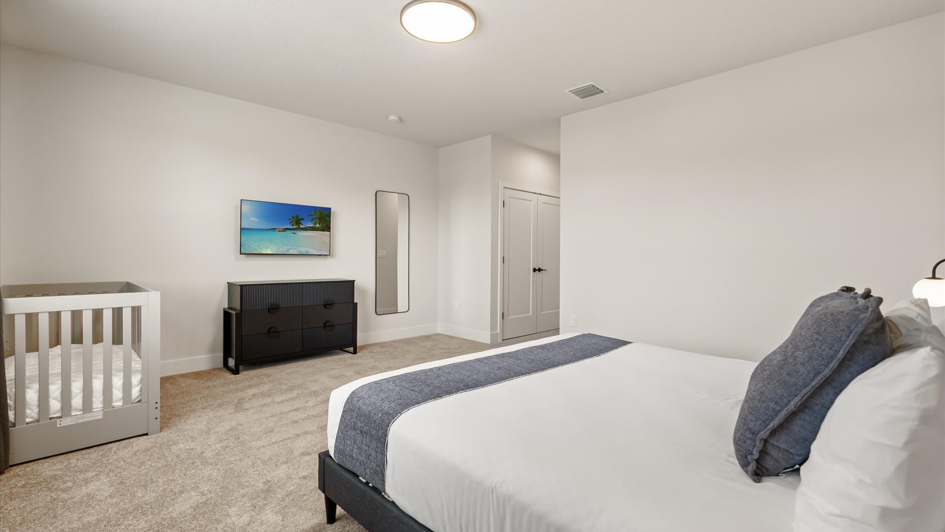Master Bedroom with Baby Cot and Smart TV