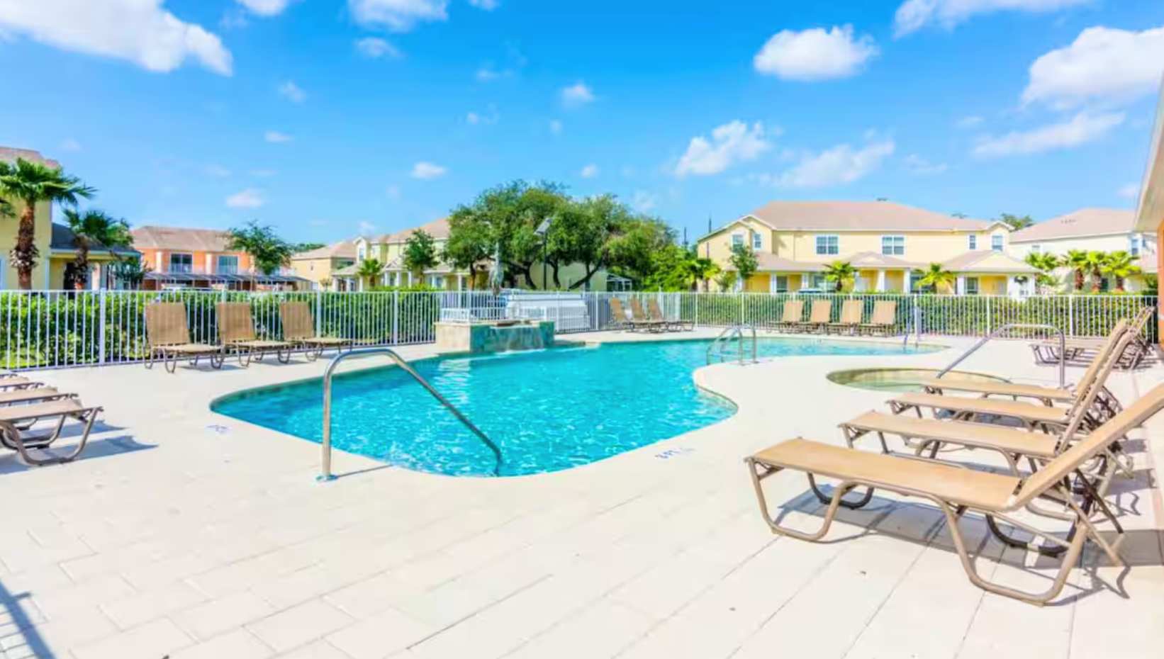 Resort Outdoor Community Pool with Sun Loungers