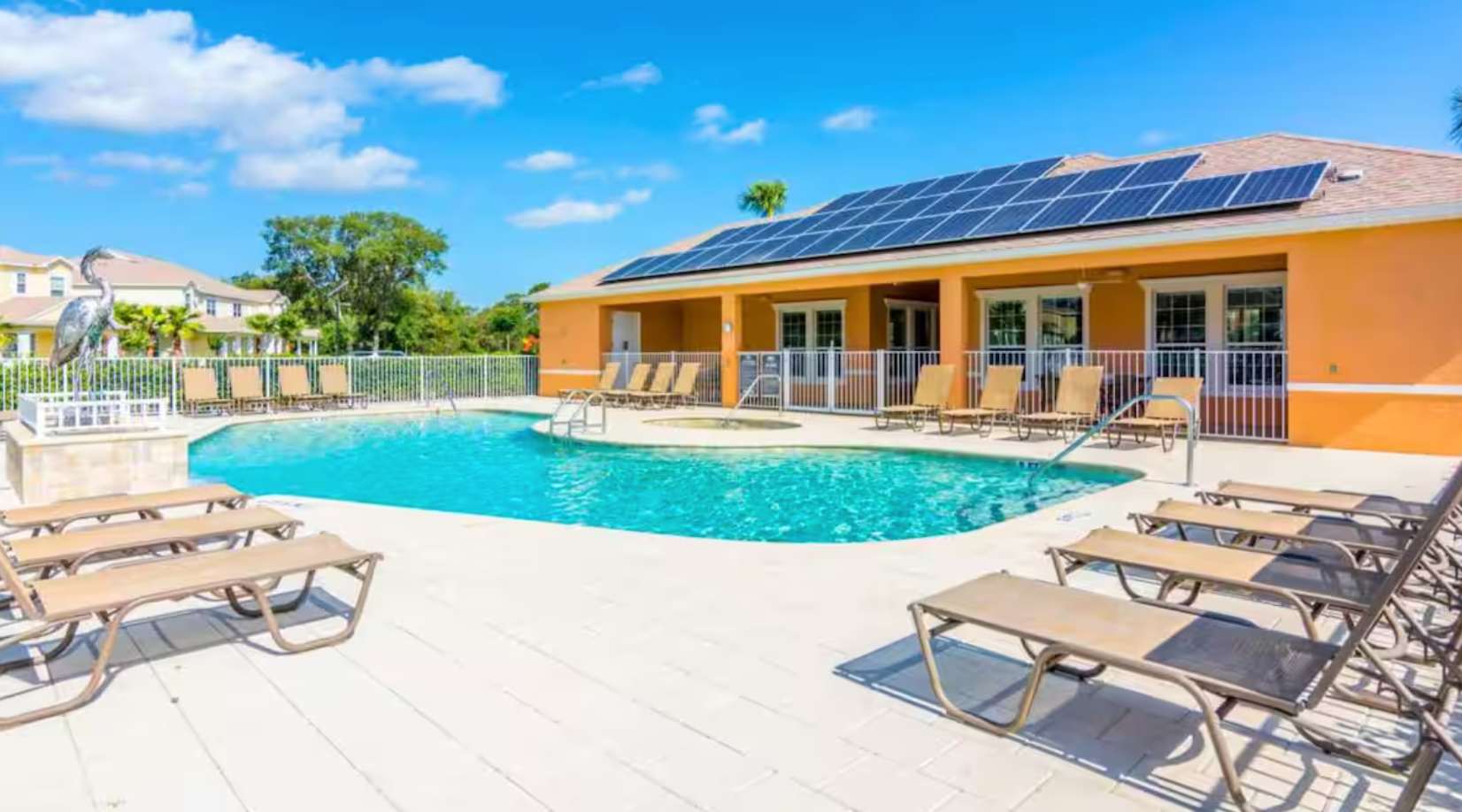 Resort Outdoor Community Pool with Sun Loungers