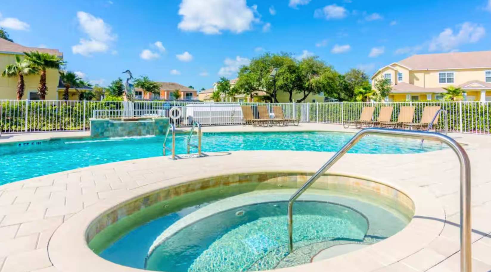 Resort Outdoor Community Pool with Sun Loungers