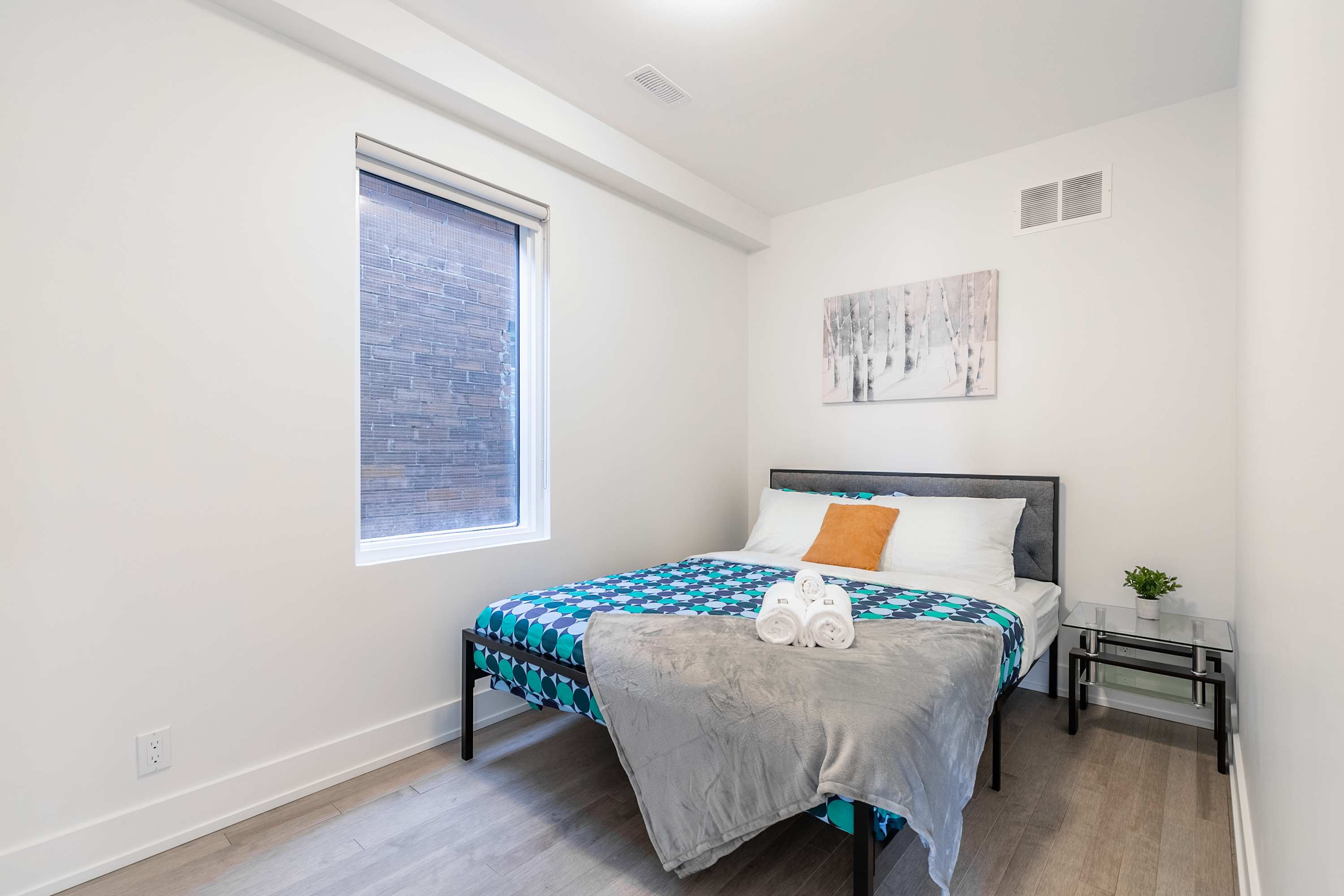 First bedroom with a double bed and fresh linens