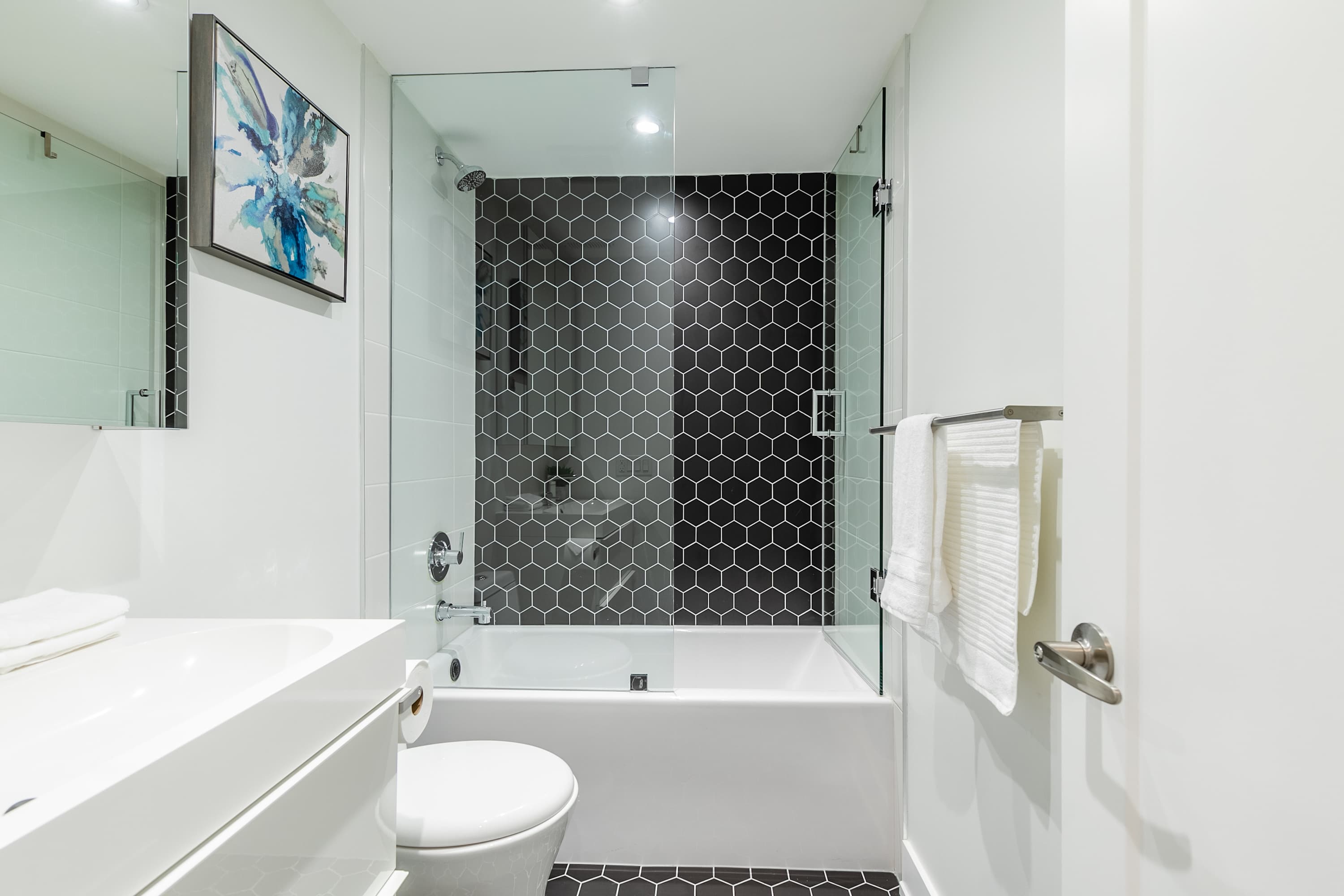 Full bathroom with combined bathtub and shower