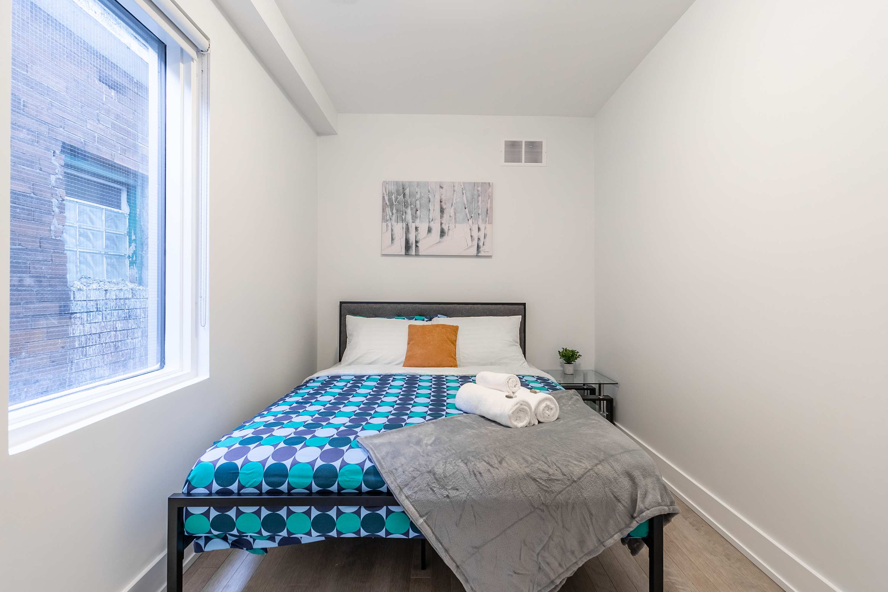 First bedroom with a double bed and fresh linens
