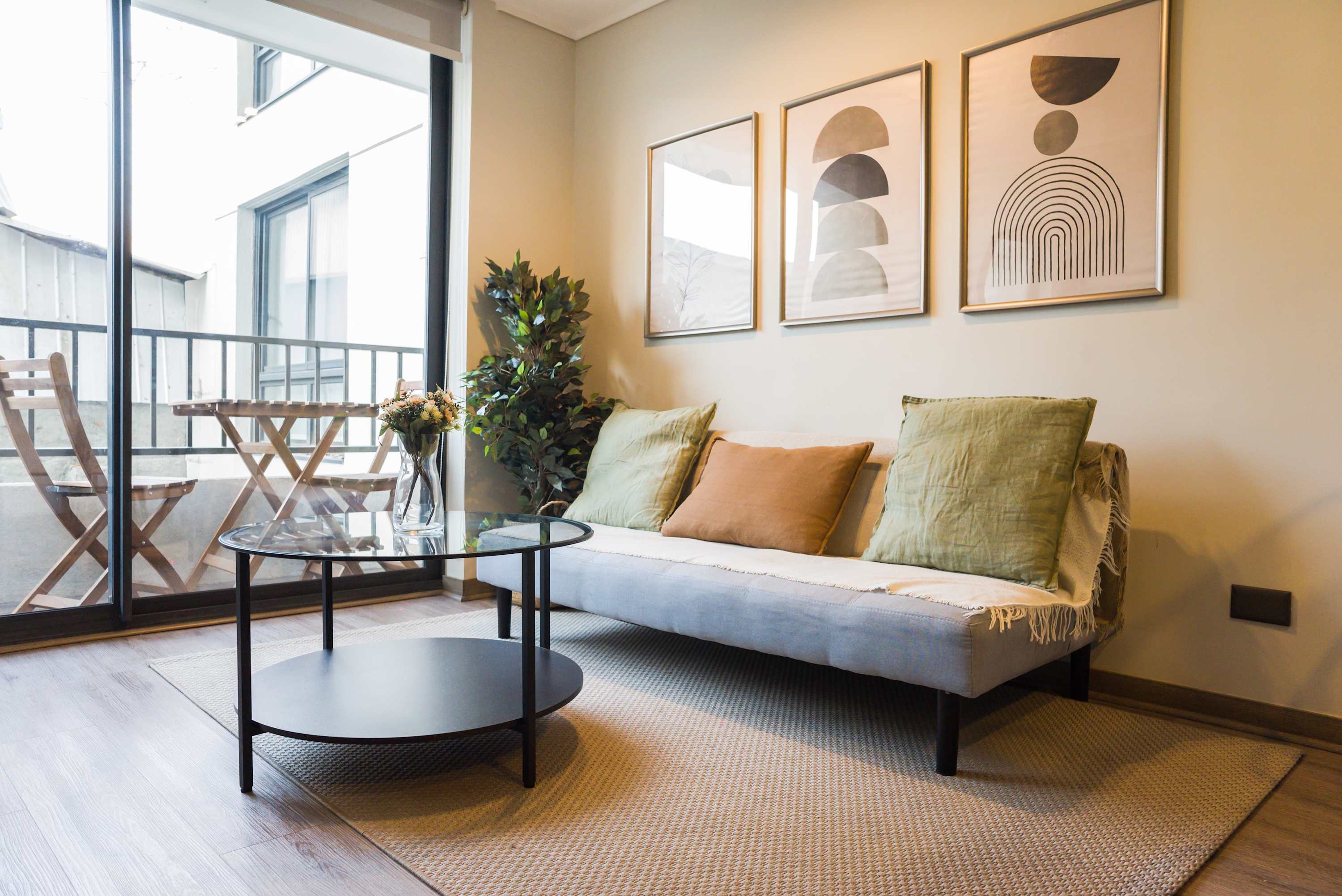 Relax in this stylish living area with balcony access, perfect for unwinding after a day exploring the city.