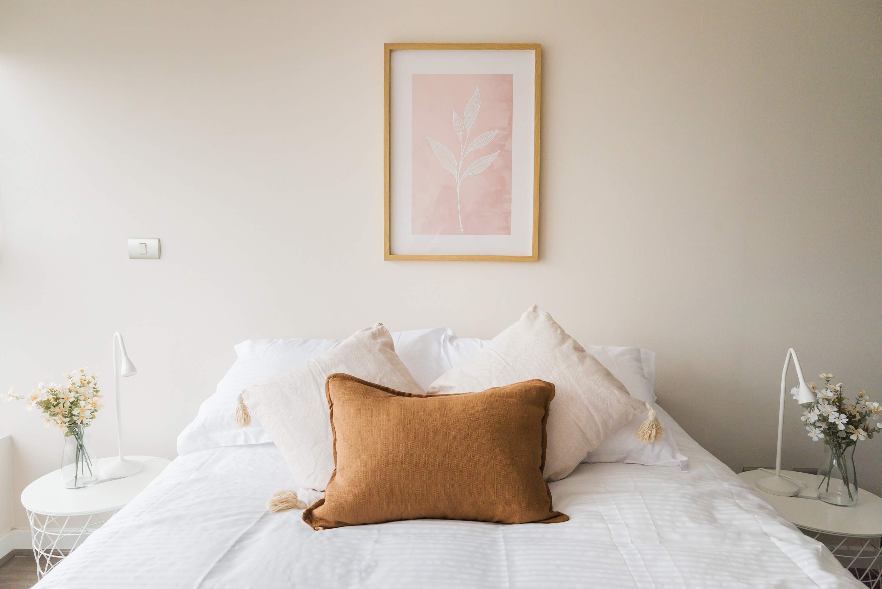 Relax in this cozy bedroom with soft lighting and stylish decor, perfect for a restful stay.