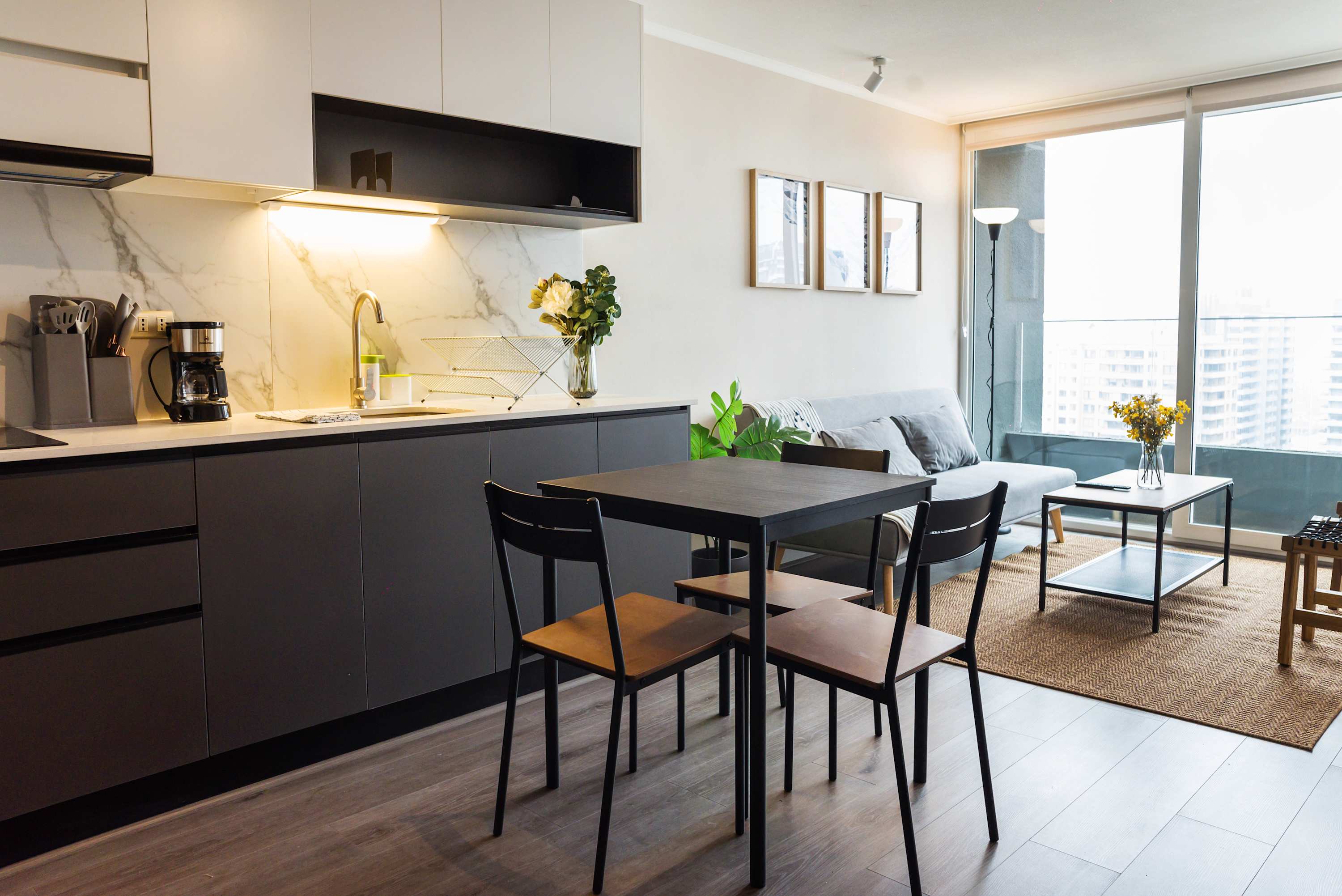 Chic studio with modern kitchen and cozy living space, perfect for a relaxing stay in the heart of the city.