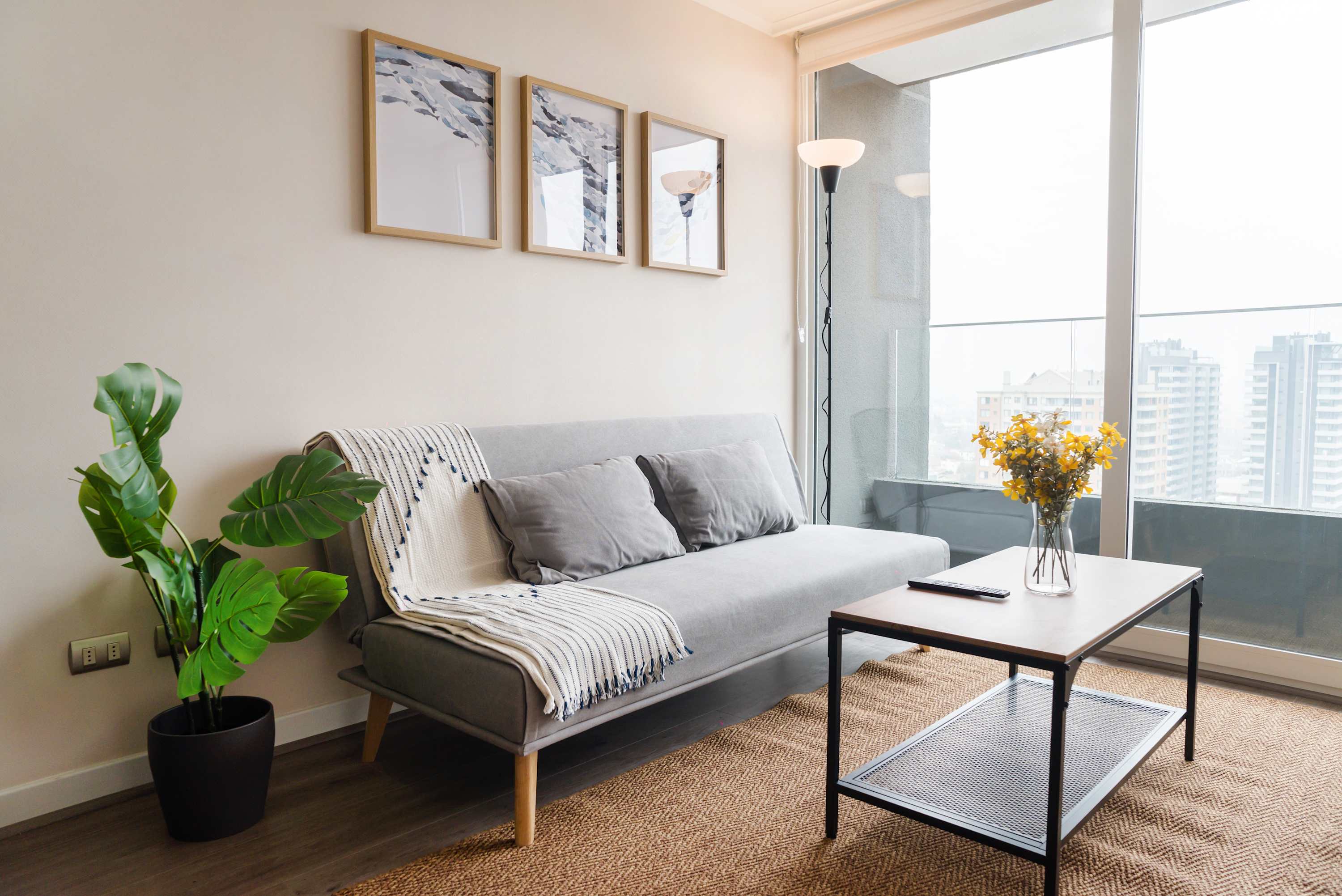 Relax in this cozy living space with stunning city views, perfect for unwinding after a day of exploring.