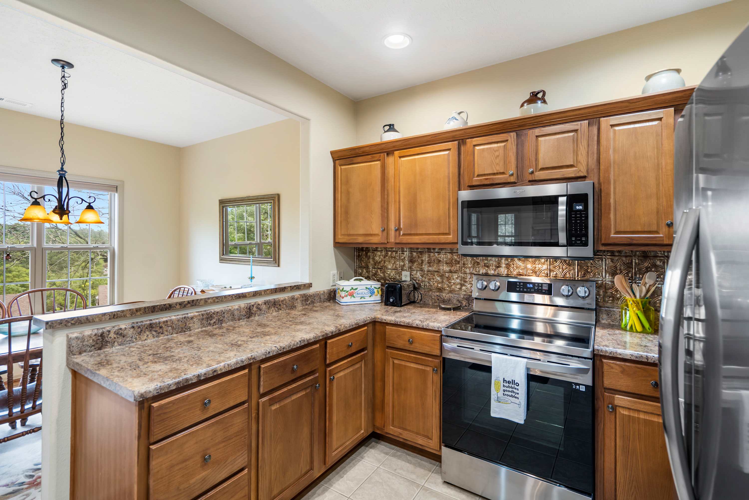 The open kitchen offers ample space & all the comforts of home​