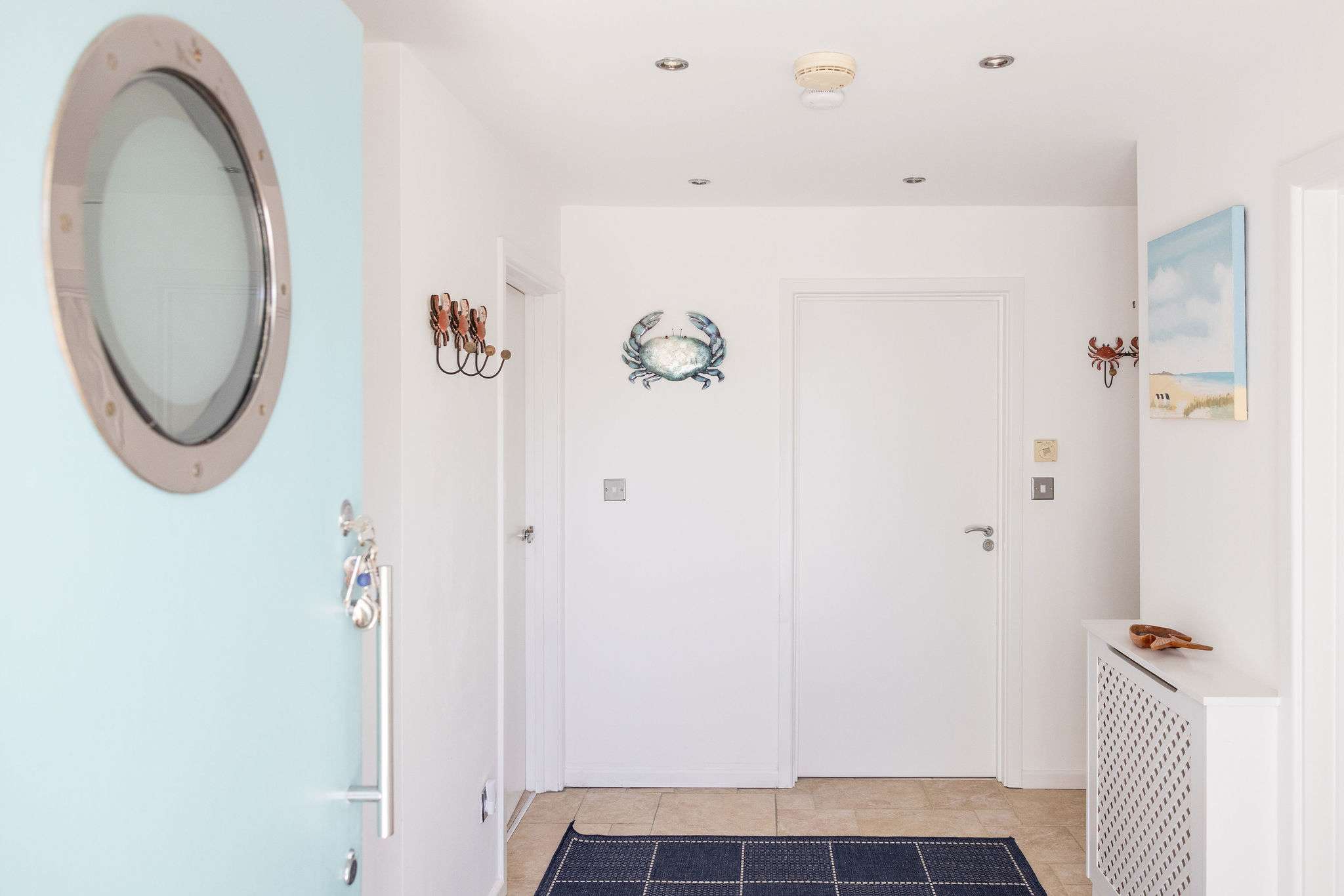 Bright, coastal-style hallway with charming details