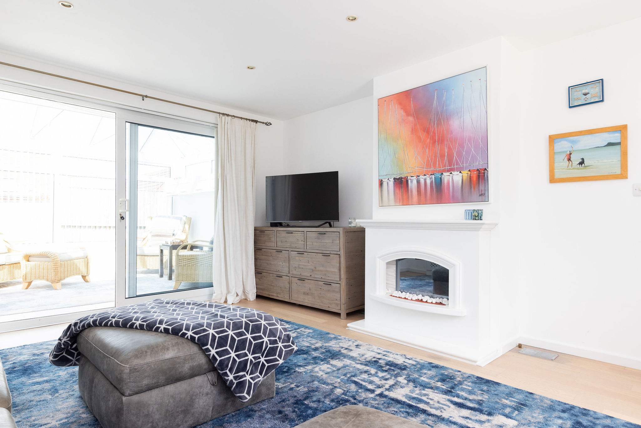 Bright lounge with smart TV and access to conservatory