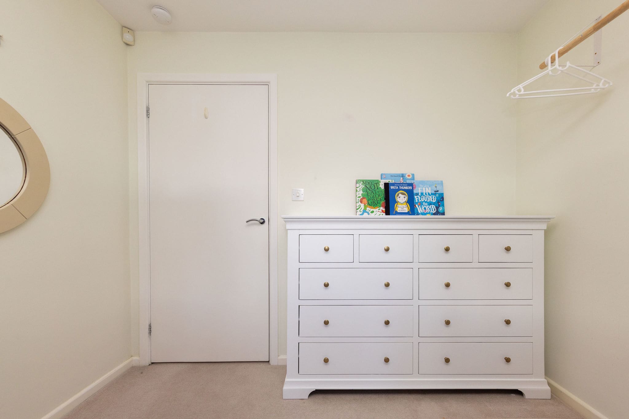 Practical chest of drawers and hanging space for little guests