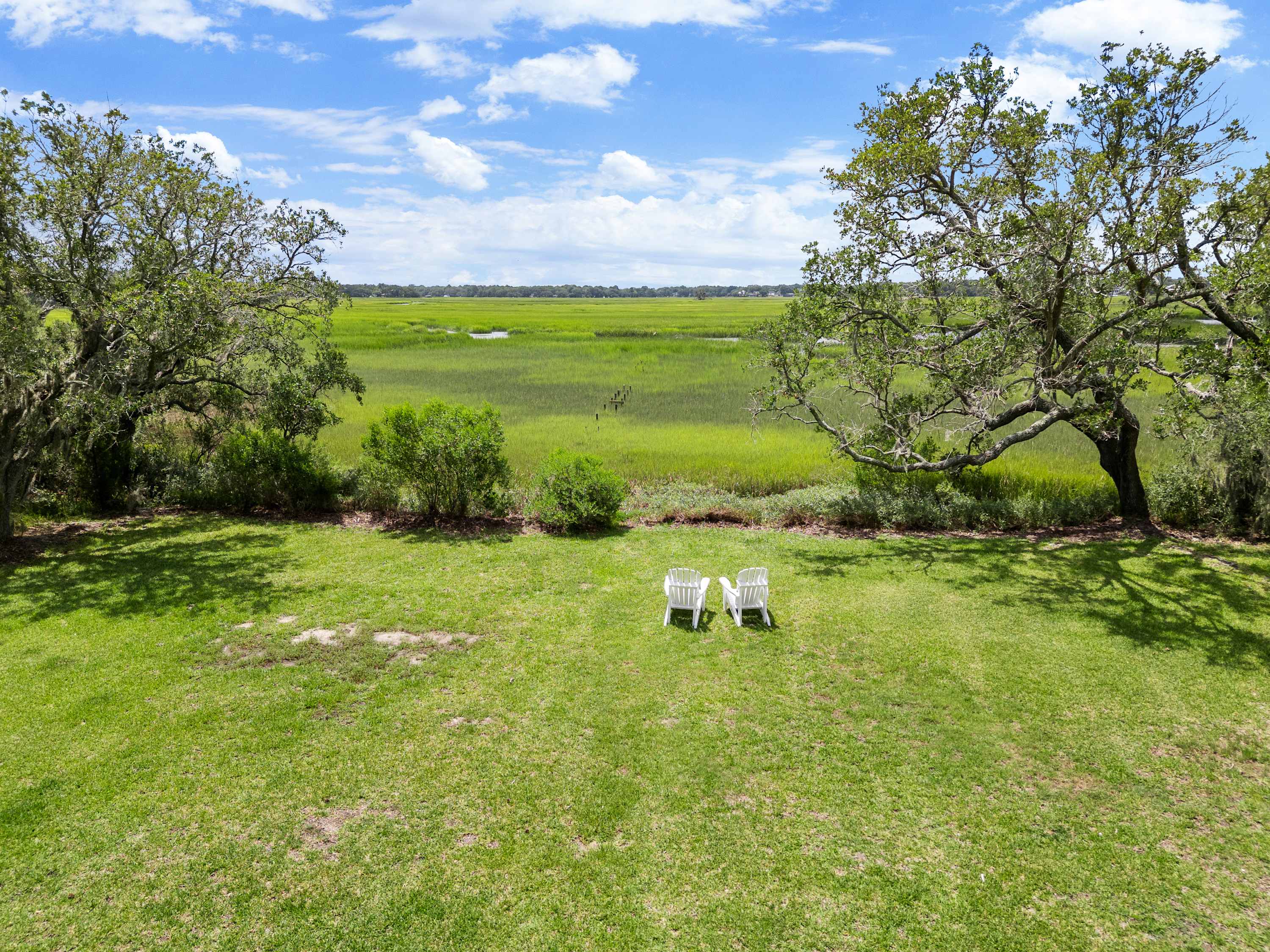 Spacious backyard that looks out into the marsh and creek! 