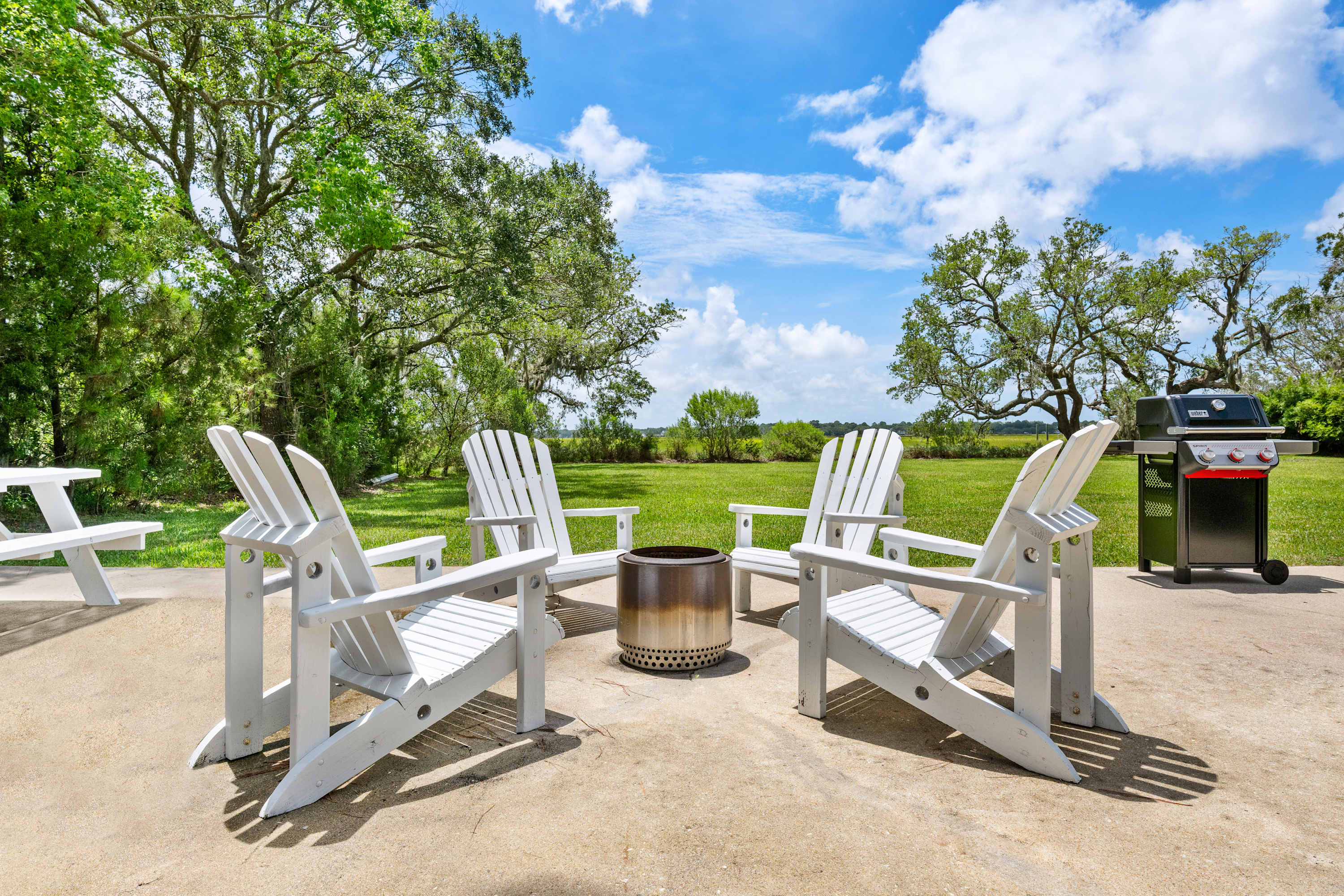 Plenty of seating on the patio with endless views of the creek and marsh!