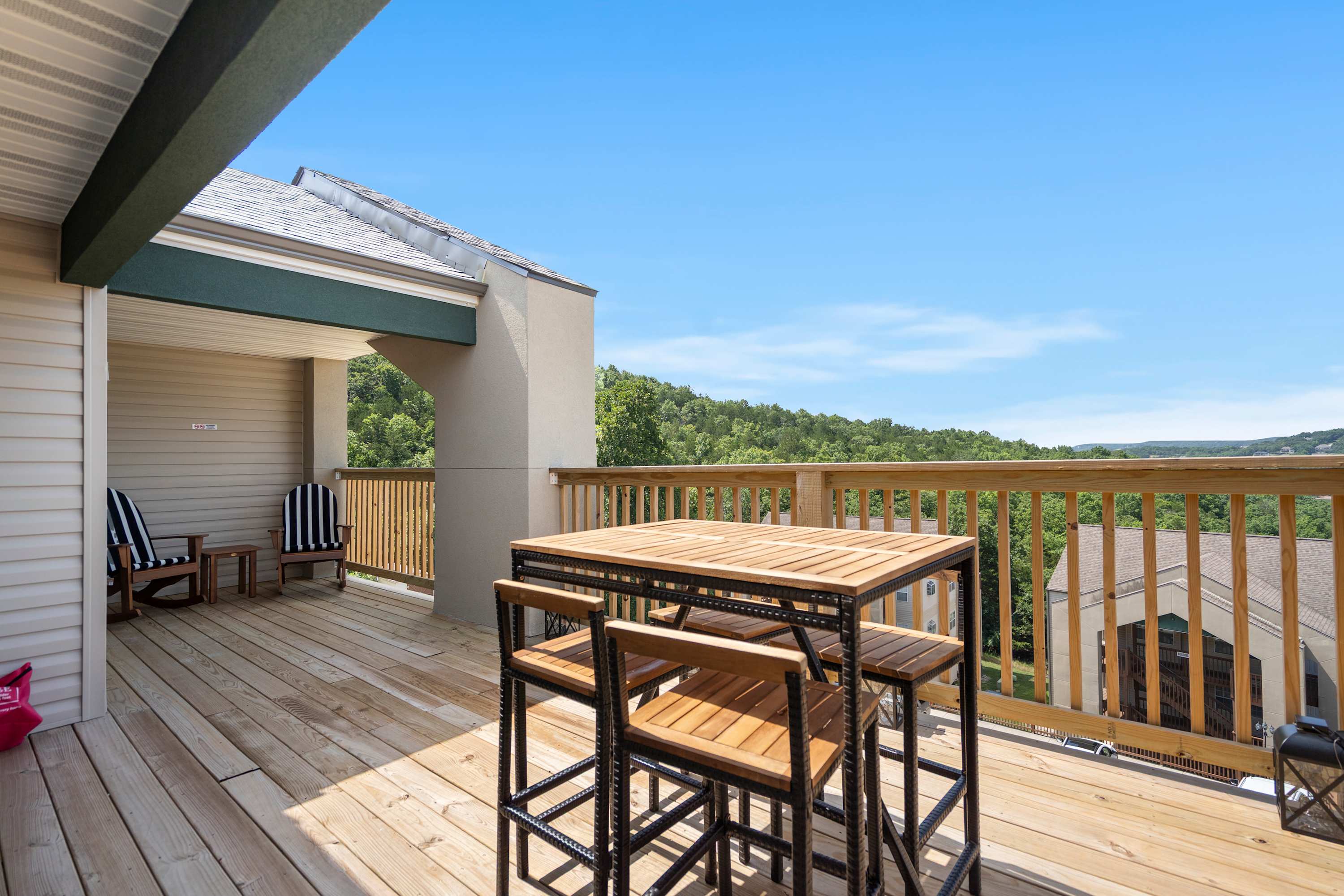 Lounge the day away or dine alfresco with stunning lake views on the deck​