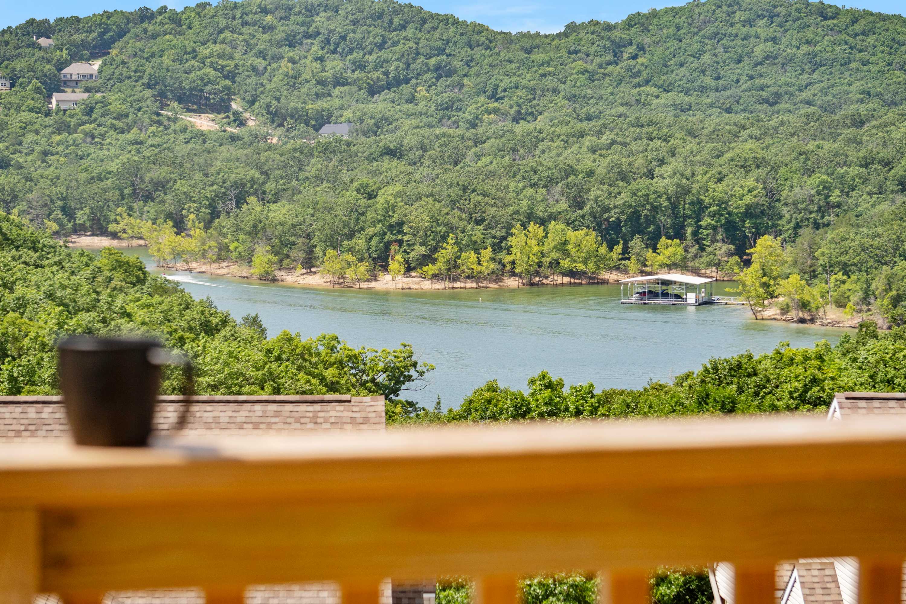 Lounge the day away or dine alfresco with stunning lake views on the deck​