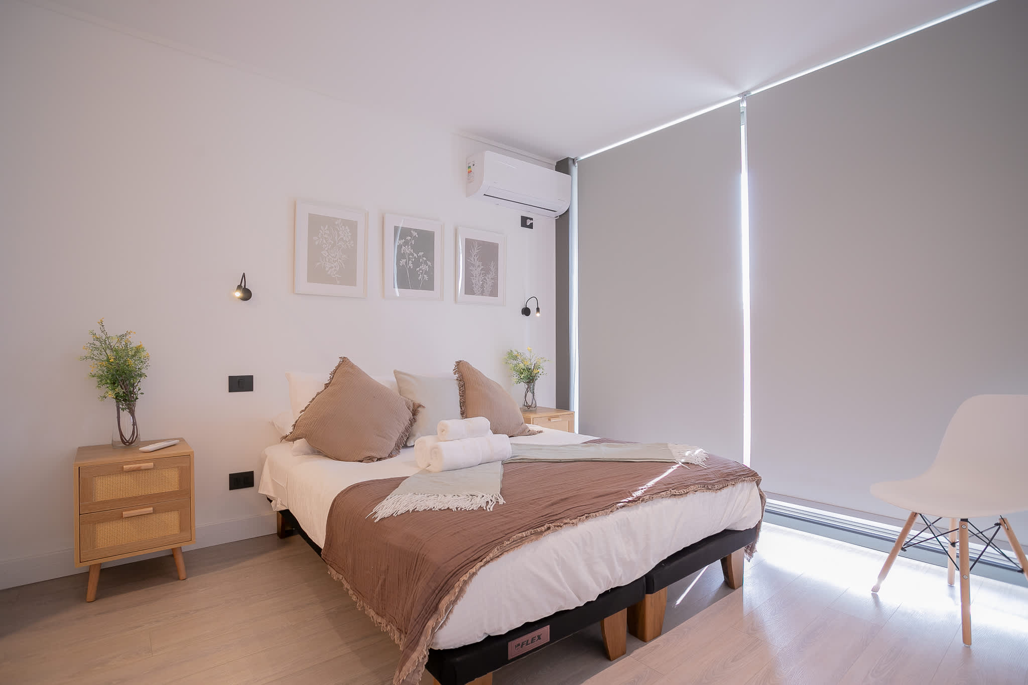 Relax in this serene bedroom with cozy decor and soft lighting, perfect for unwinding after a day of exploring.